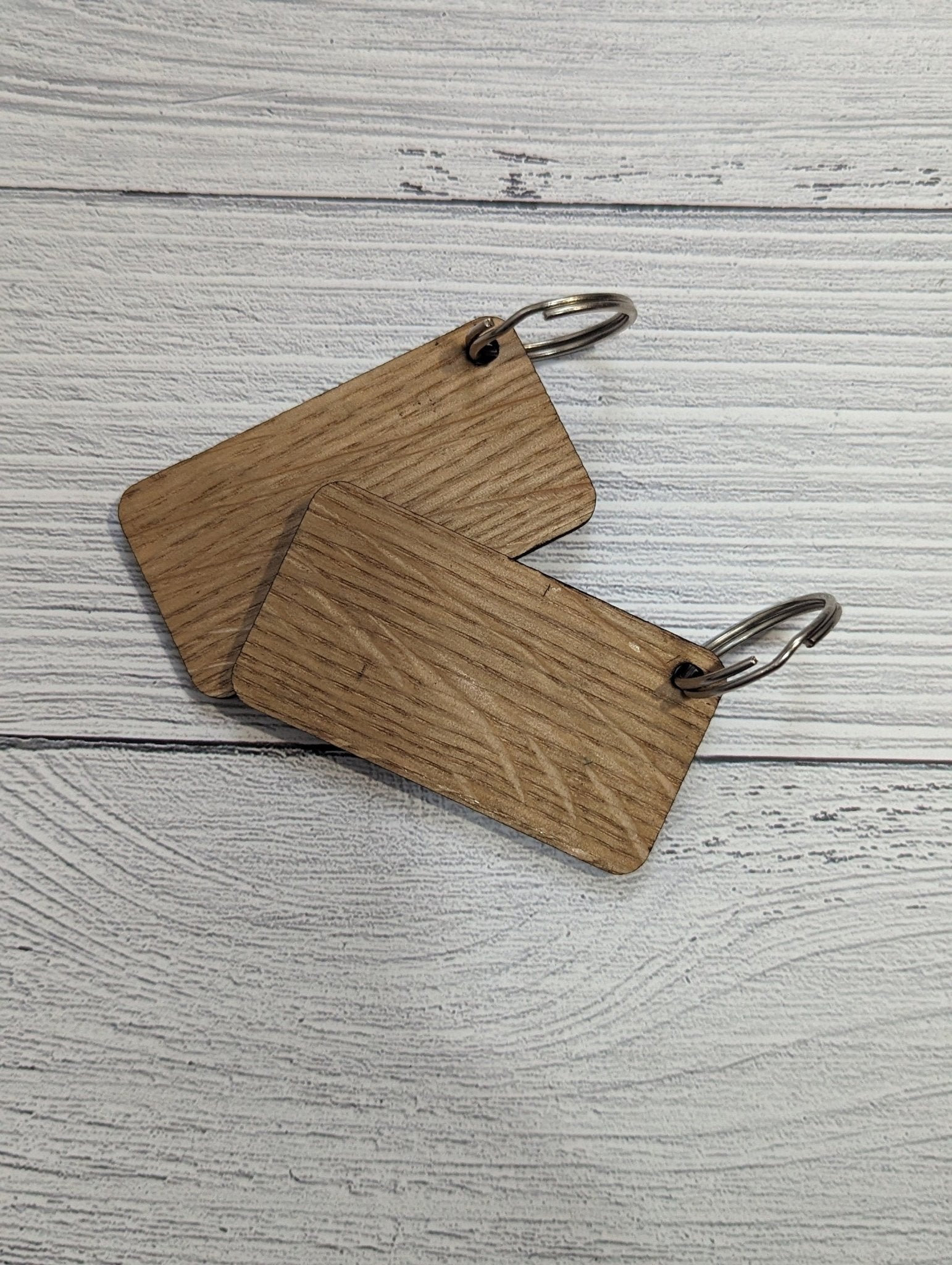 Handmade Union Jack Keyring made from oak MDF, featuring laser engraved design, measuring 65mm x 35mm.