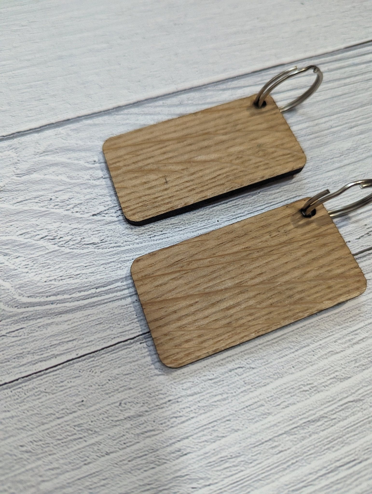 Handmade Union Jack Keyring made from oak MDF, featuring laser engraved design, measuring 65mm x 35mm.