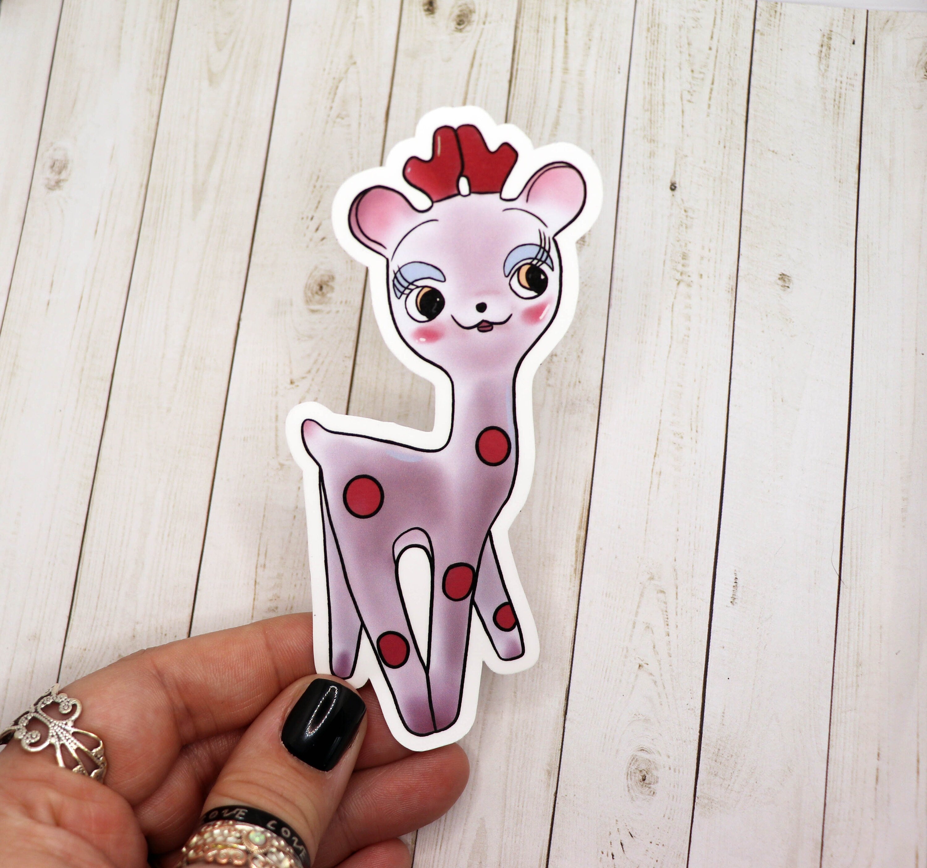 A vintage style giraffe sticker featuring a whimsical design, perfect for personalizing various items.