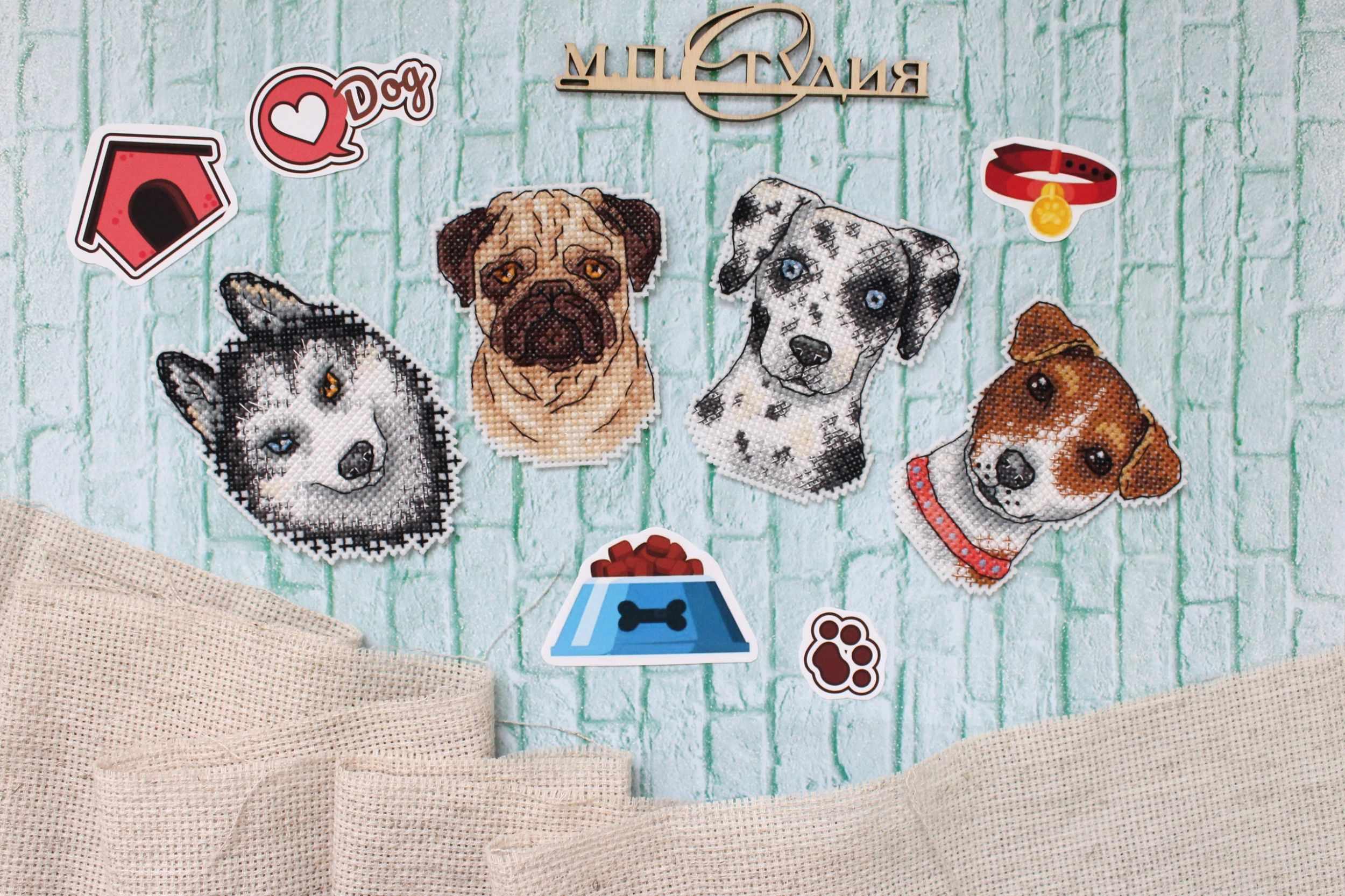 Who Said Woof? Magnets SR-409 Cross Stitch Kit featuring colorful threads, plastic canvas, and finished dog-themed magnets.