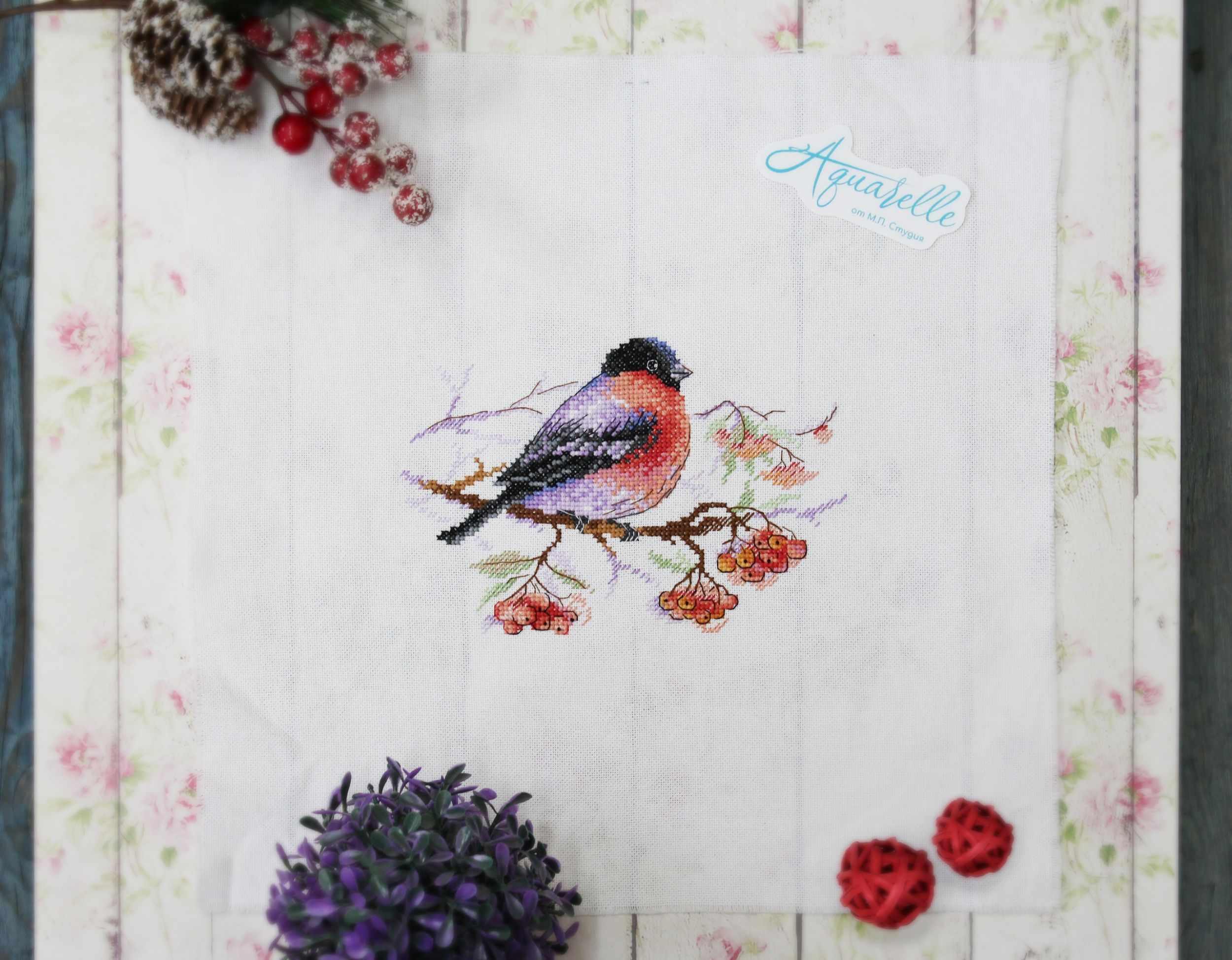 Winter Wanderer Cross Stitch Kit featuring a bullfinch design on 27 count white canvas with included threads and instructions.