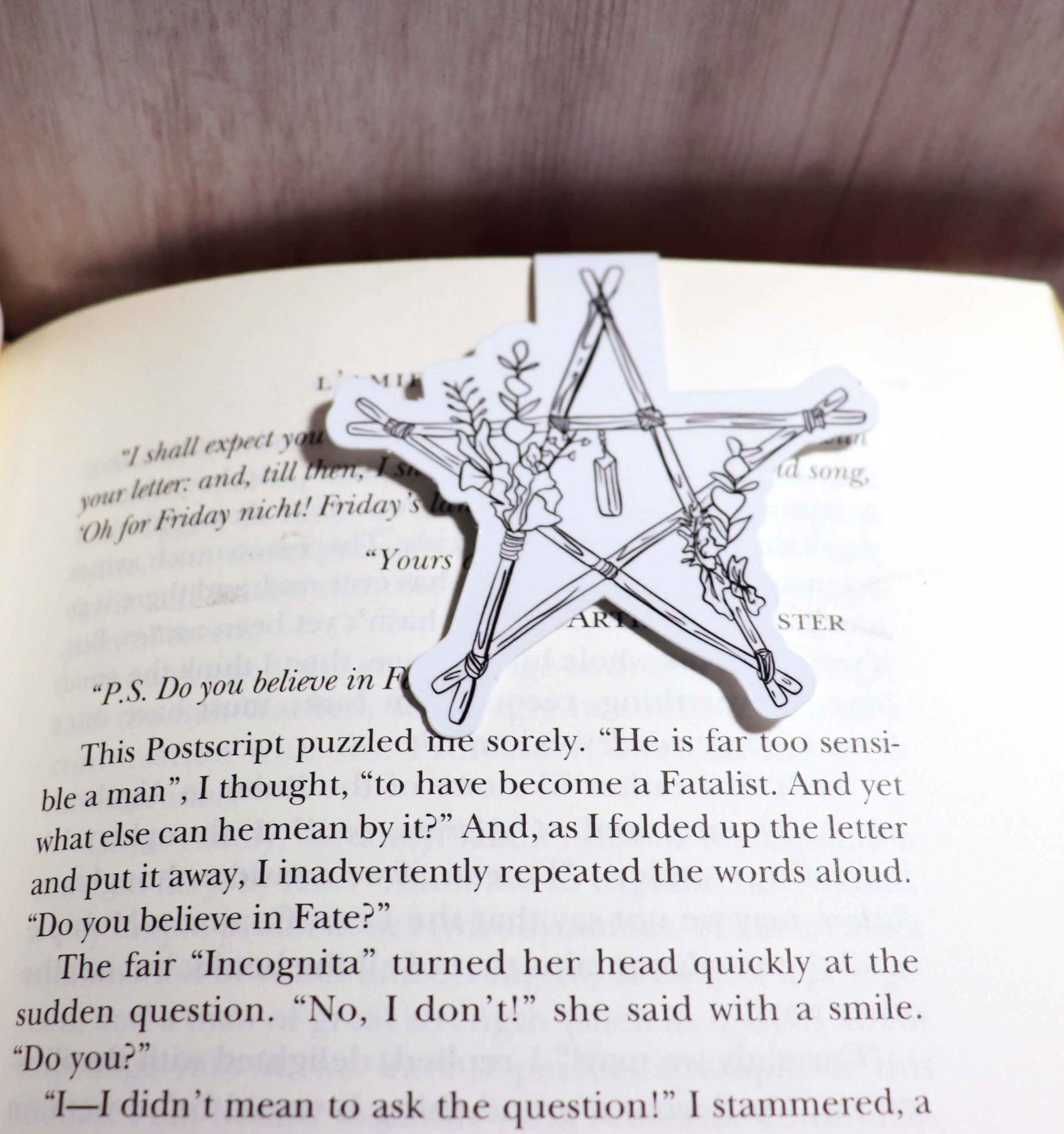 A beautifully designed Witch Star Bookmark featuring a mystical star pattern, double-sided, with strong magnets for secure page holding.