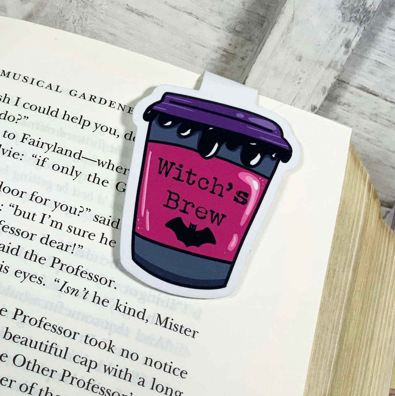 Witch's Brew Coffee Bookmark featuring a whimsical design, double-sided, with strong magnets and a durable laminated finish.