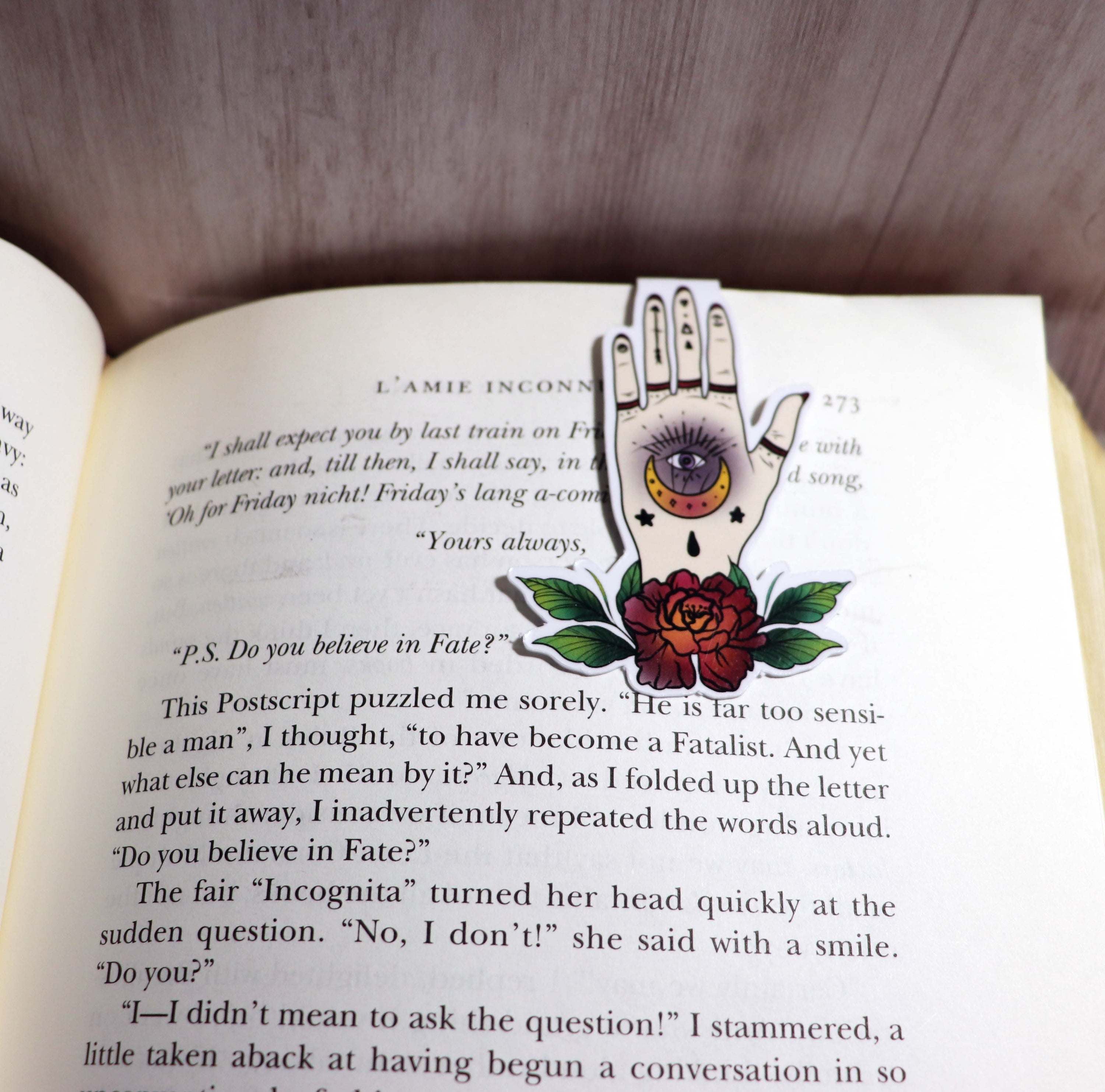 A beautifully designed Witchy Hand Bookmark featuring a mystical hand illustration, double-sided, with strong magnets for secure page holding.