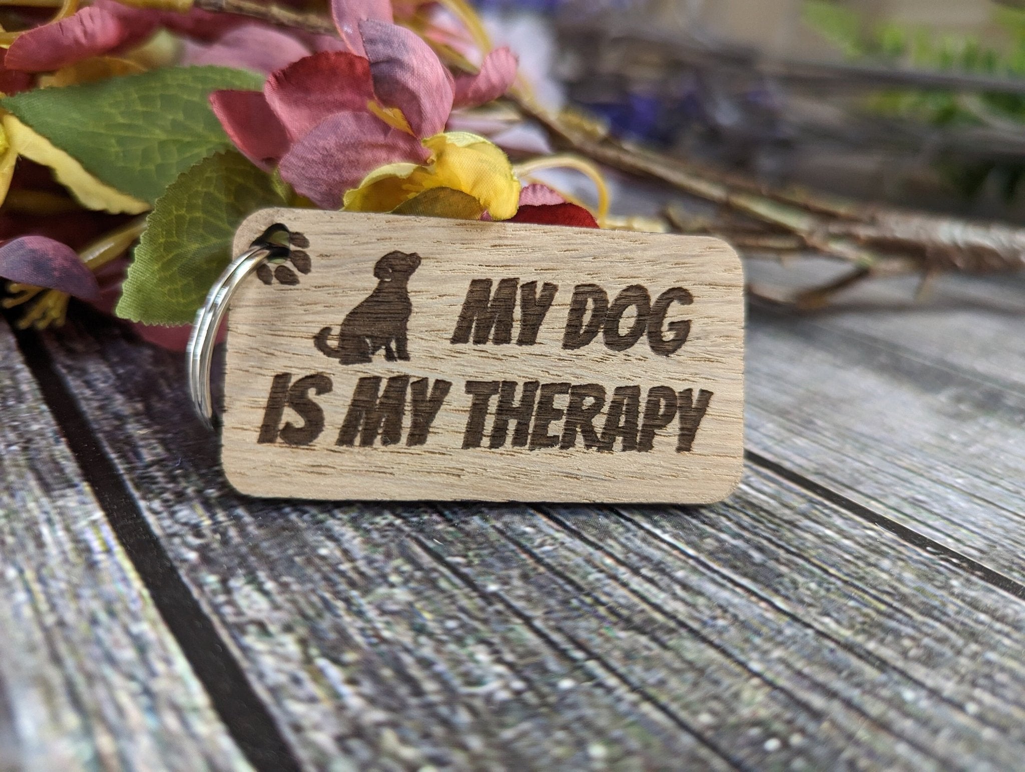 Eco-friendly wooden keyring engraved with 'My Dog is My Therapy', crafted from sustainable oak wood, perfect for dog lovers.