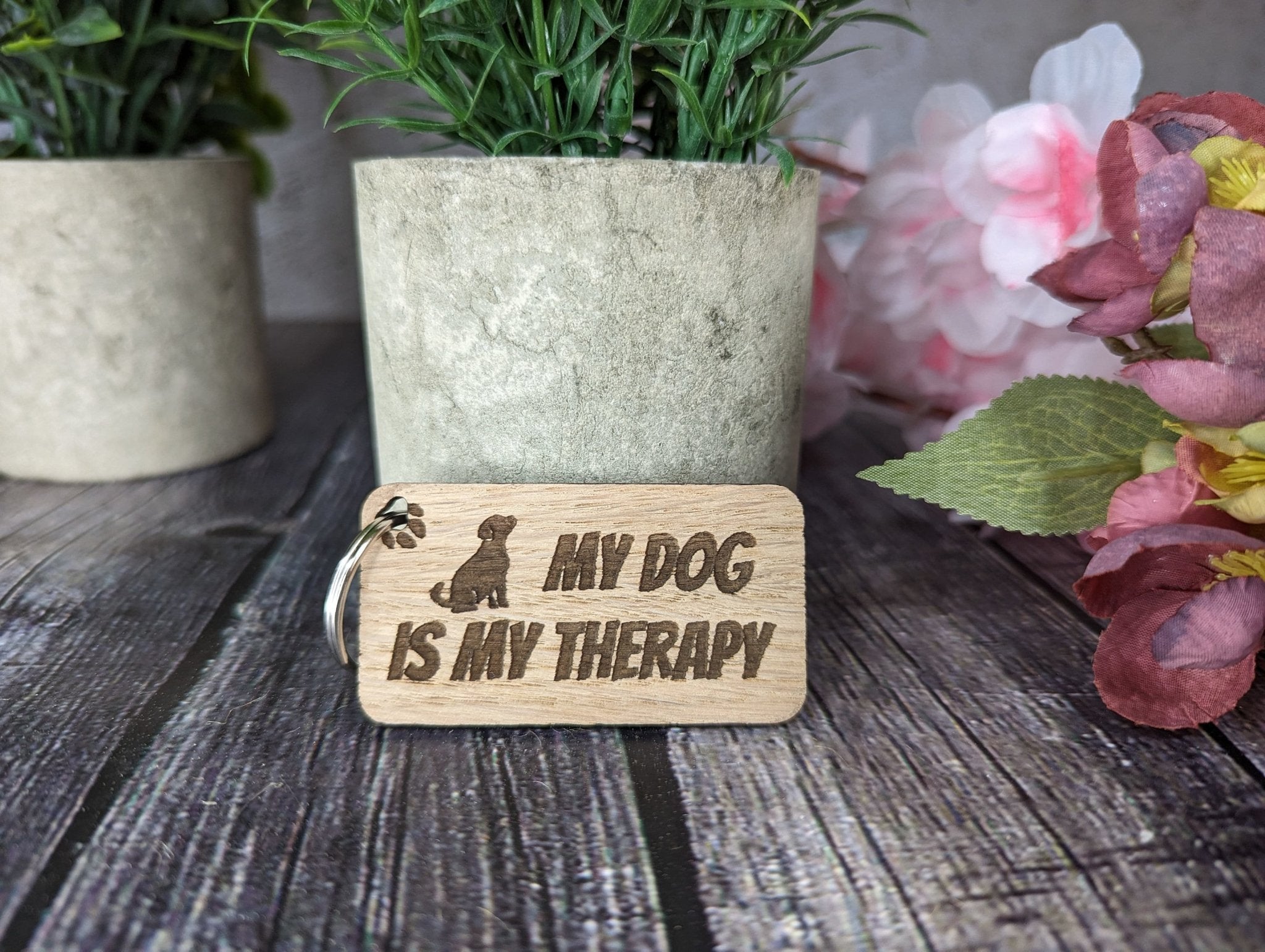 Eco-friendly wooden keyring engraved with 'My Dog is My Therapy', crafted from sustainable oak wood, perfect for dog lovers.