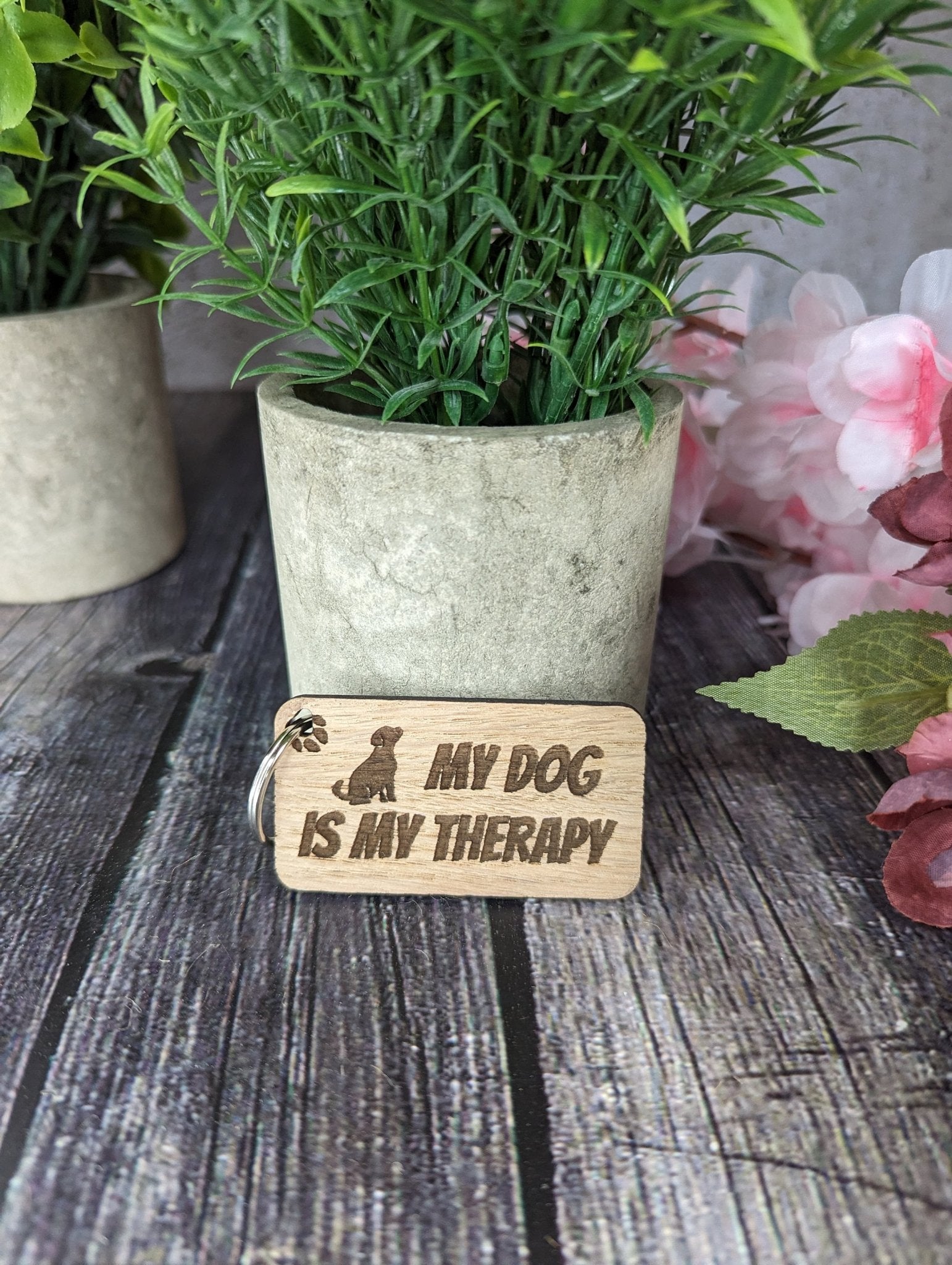 Eco-friendly wooden keyring engraved with 'My Dog is My Therapy', crafted from sustainable oak wood, perfect for dog lovers.