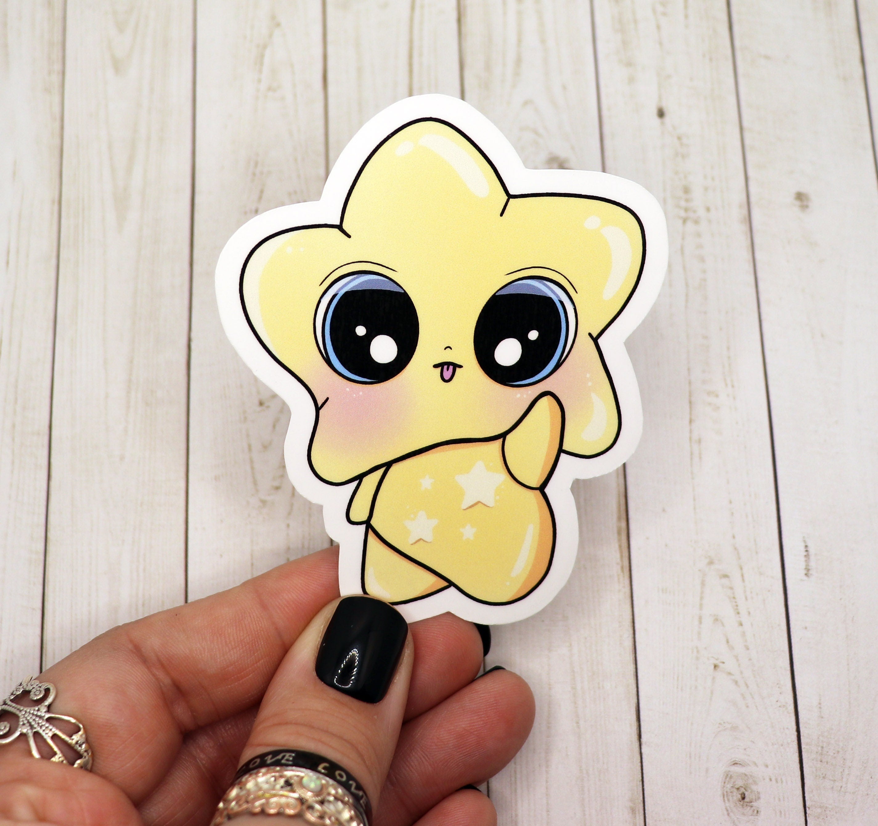 A vibrant yellow star baby sticker on a white background, showcasing its 3-inch size and matte finish.