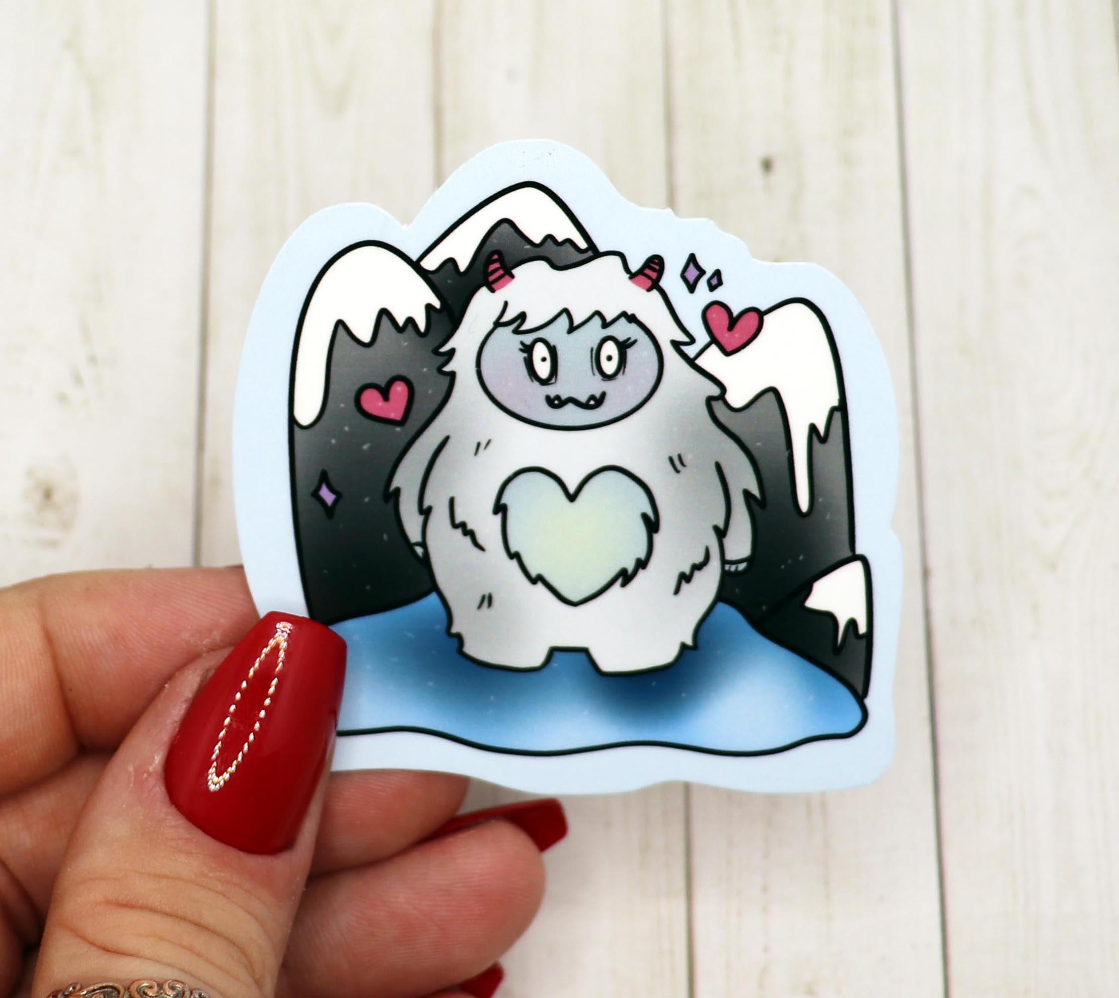 A 2.5-inch Yeti vinyl sticker on a matte surface, showcasing its vibrant design and laminated finish.