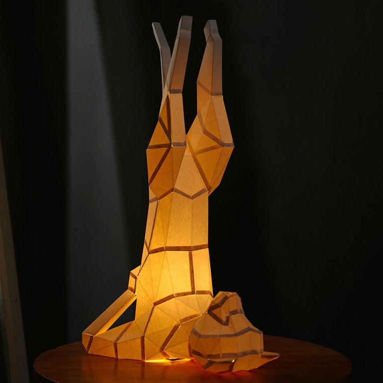 A beautifully crafted Yoga Cat 3D Paper Model lamp in a yoga pose, showcasing intricate paper art design.