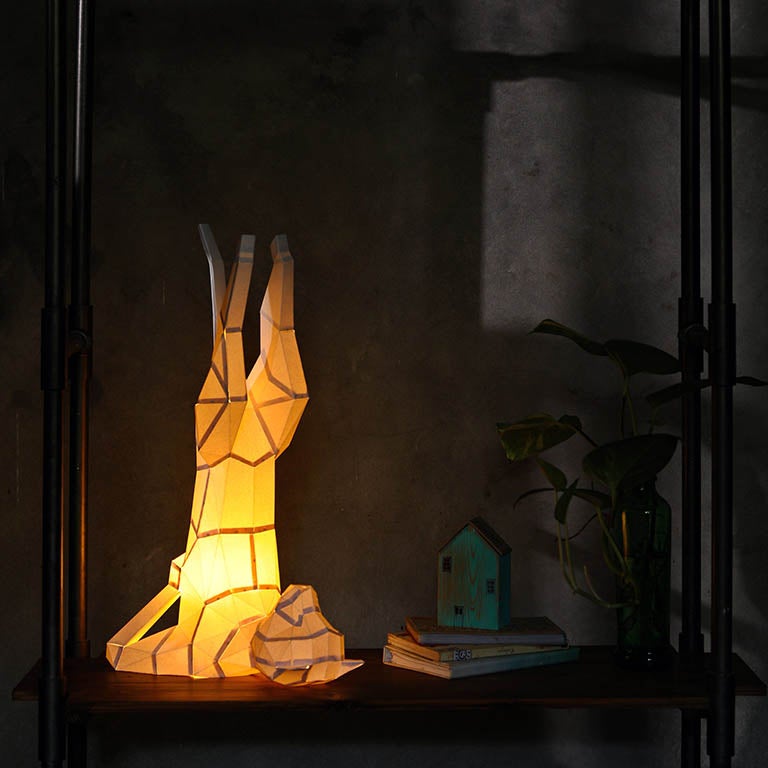 A beautifully crafted Yoga Cat 3D Paper Model lamp in a yoga pose, showcasing intricate paper art design.