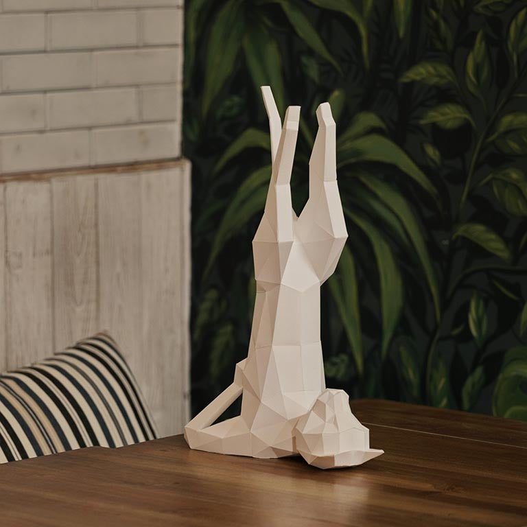 A beautifully crafted Yoga Cat 3D Paper Model lamp in a yoga pose, showcasing intricate paper art design.