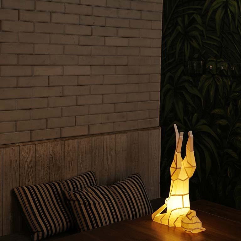 A beautifully crafted Yoga Cat 3D Paper Model lamp in a yoga pose, showcasing intricate paper art design.