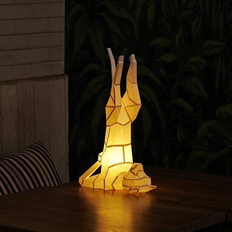 A beautifully crafted Yoga Cat 3D Paper Model lamp in a yoga pose, showcasing intricate paper art design.