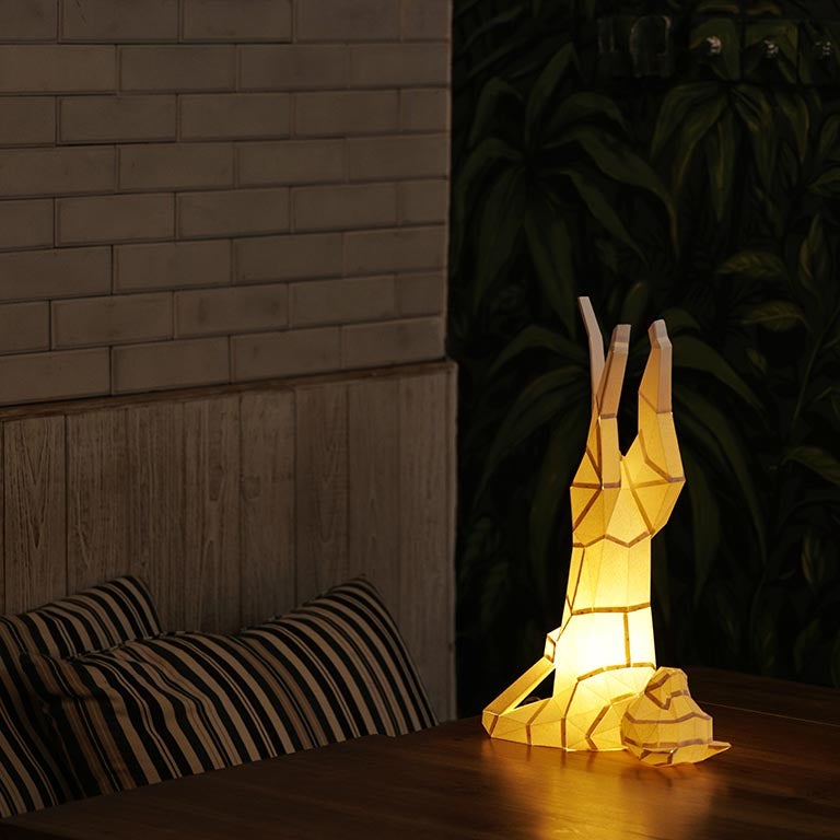 A beautifully crafted Yoga Cat 3D Paper Model lamp in a yoga pose, showcasing intricate paper art design.