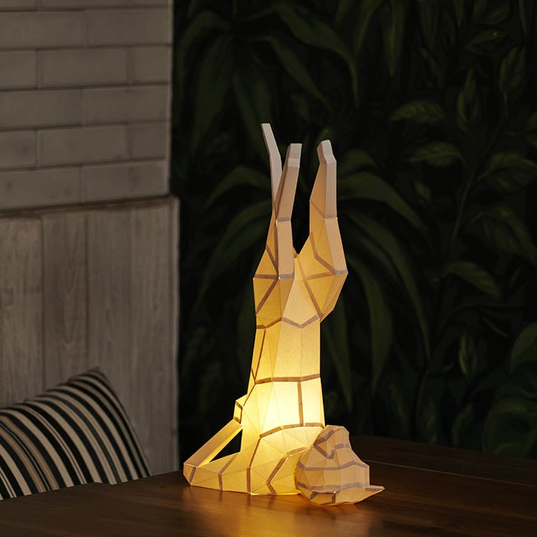 A beautifully crafted Yoga Cat 3D Paper Model lamp in a yoga pose, showcasing intricate paper art design.