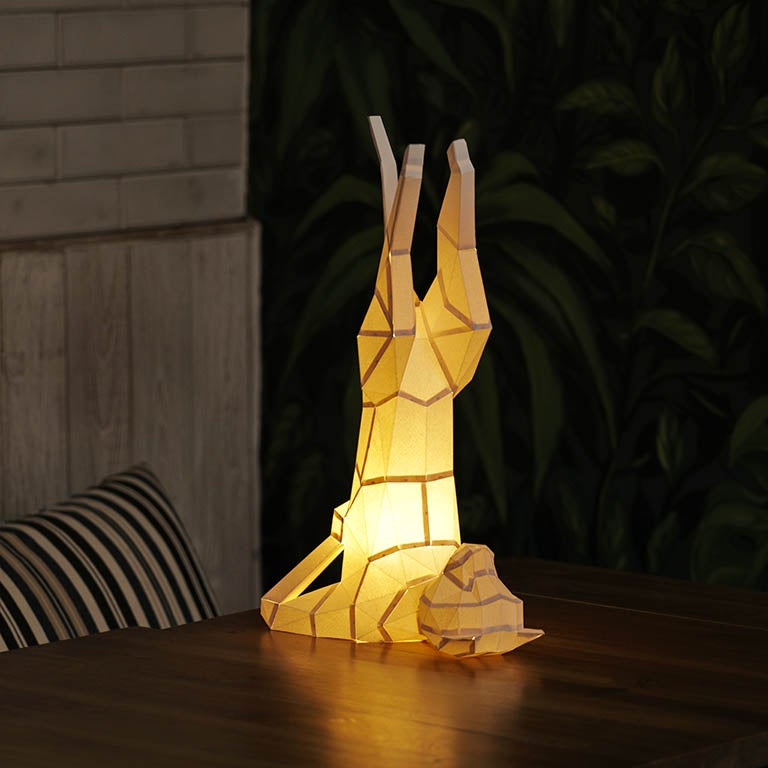 A beautifully crafted Yoga Cat 3D Paper Model lamp in a yoga pose, showcasing intricate paper art design.