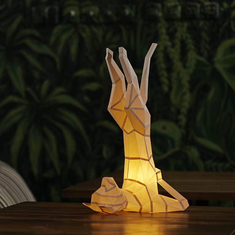 A beautifully crafted Yoga Cat 3D Paper Model lamp in a yoga pose, showcasing intricate paper art design.