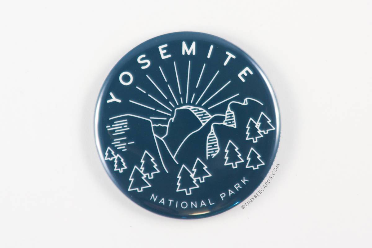 A vibrant 2.25-inch round magnet featuring Yosemite National Park scenery with text.