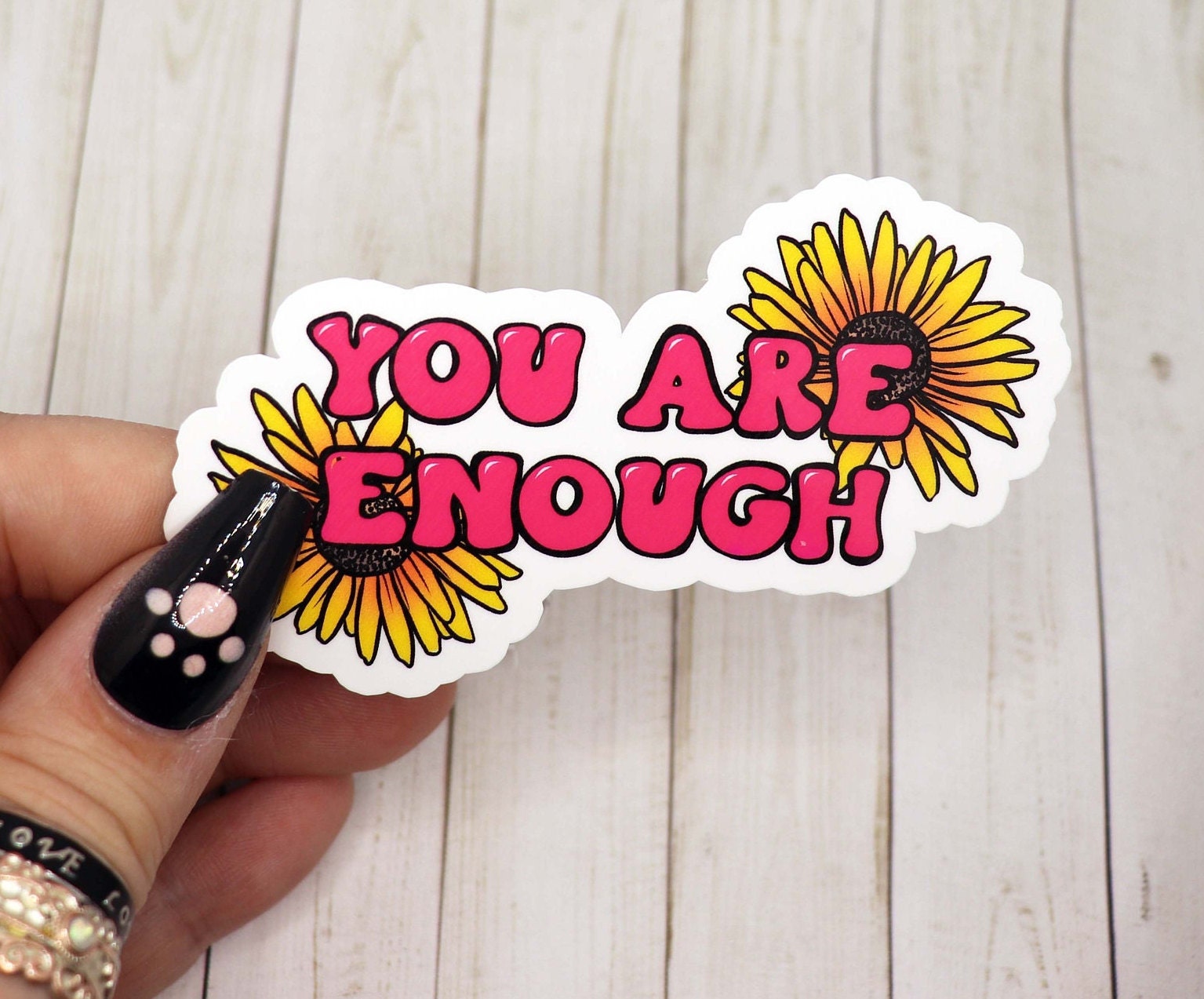 You Are Enough vinyl sticker on a white background, showcasing its motivational message and matte finish.