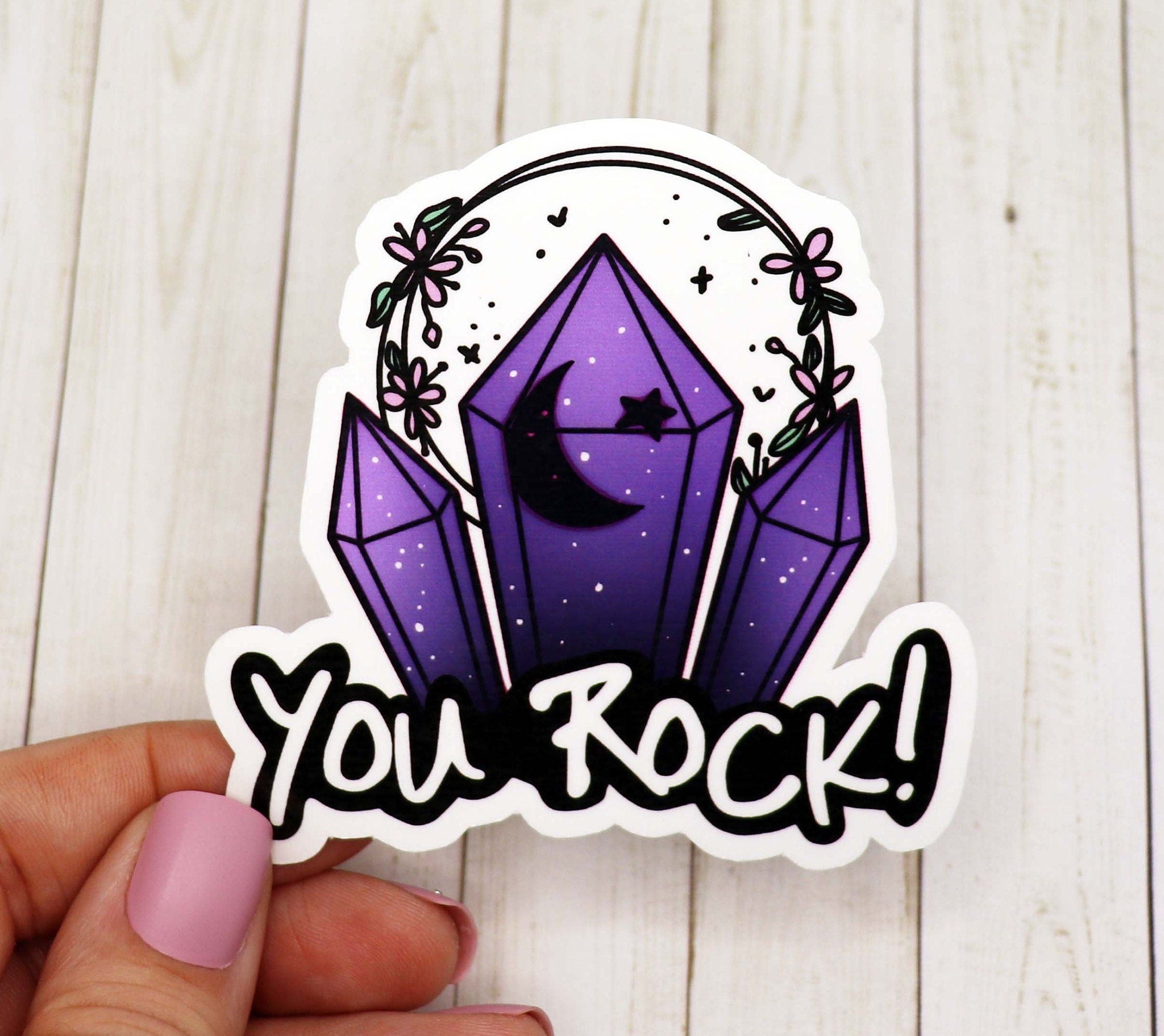 You Rock vinyl sticker on a white background, showcasing its vibrant design and matte finish.