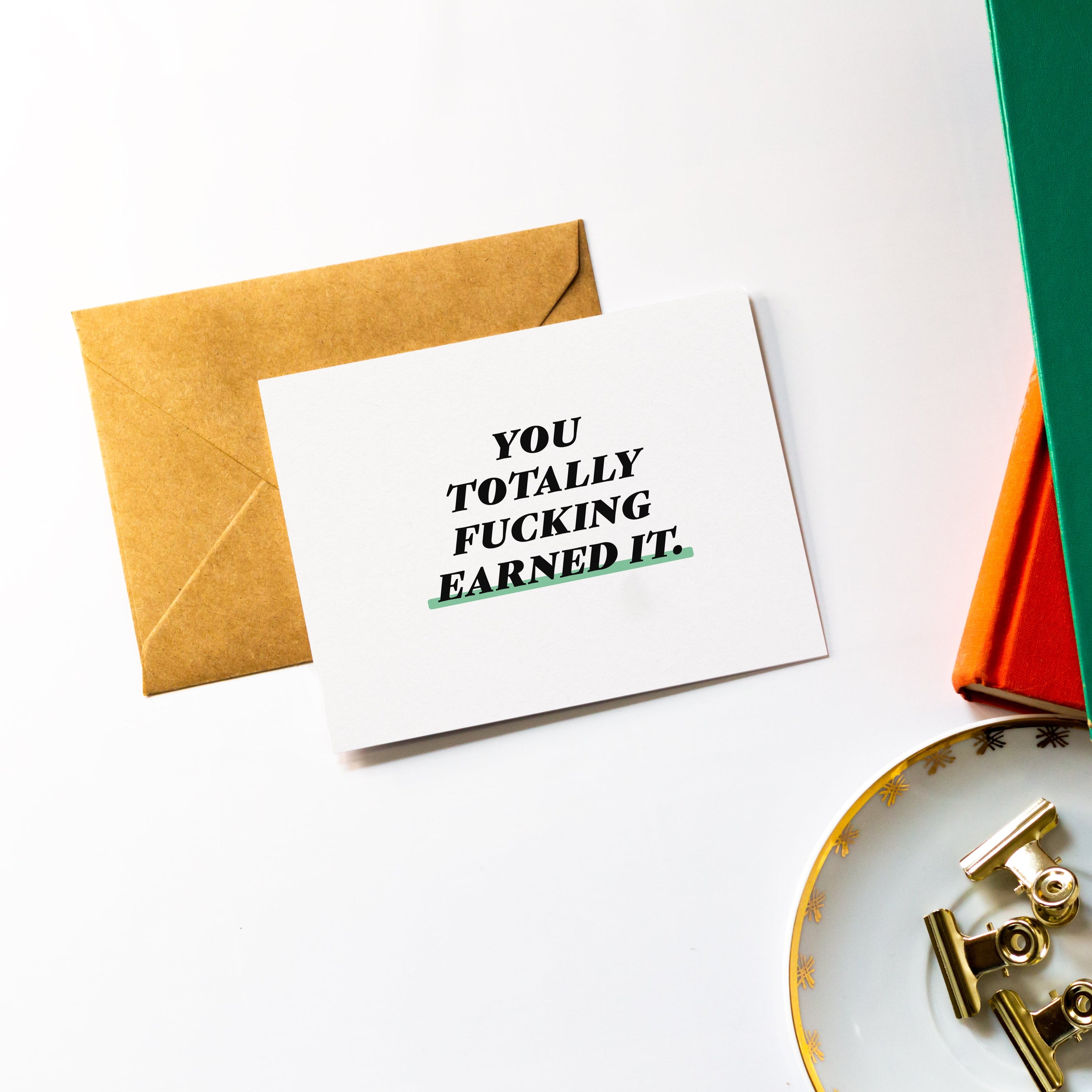 You Totally Fucking Earned It greeting card with kraft envelope, showcasing high-quality design and eco-friendly materials.