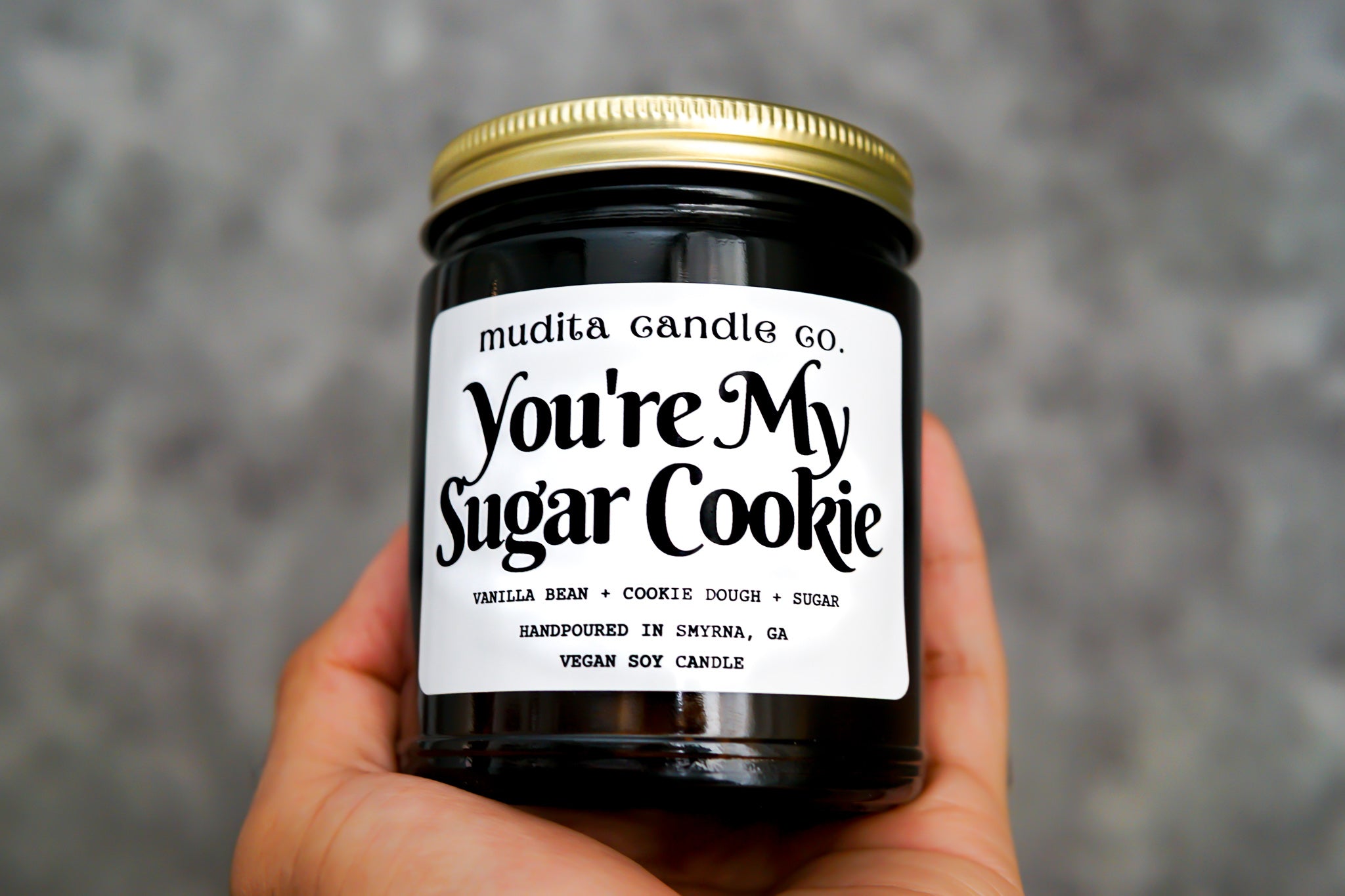 You're My Sugar Cookie candle in a 9oz amber glass jar with a gold metal lid, featuring a sweet fragrance blend of vanilla bean, cookie dough, and sugar.