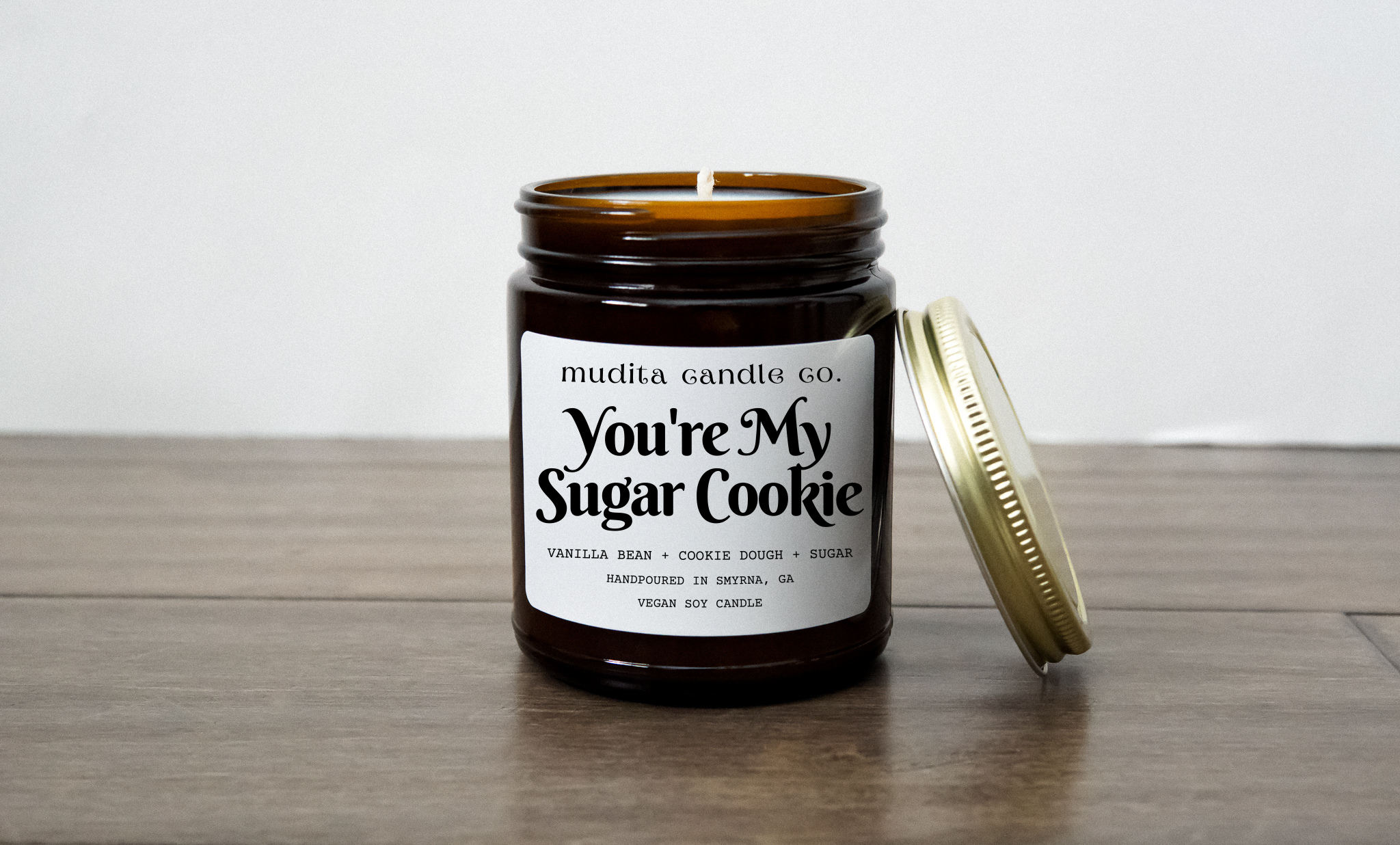 You're My Sugar Cookie candle in a 9oz amber glass jar with a gold metal lid, featuring a sweet fragrance blend of vanilla bean, cookie dough, and sugar.