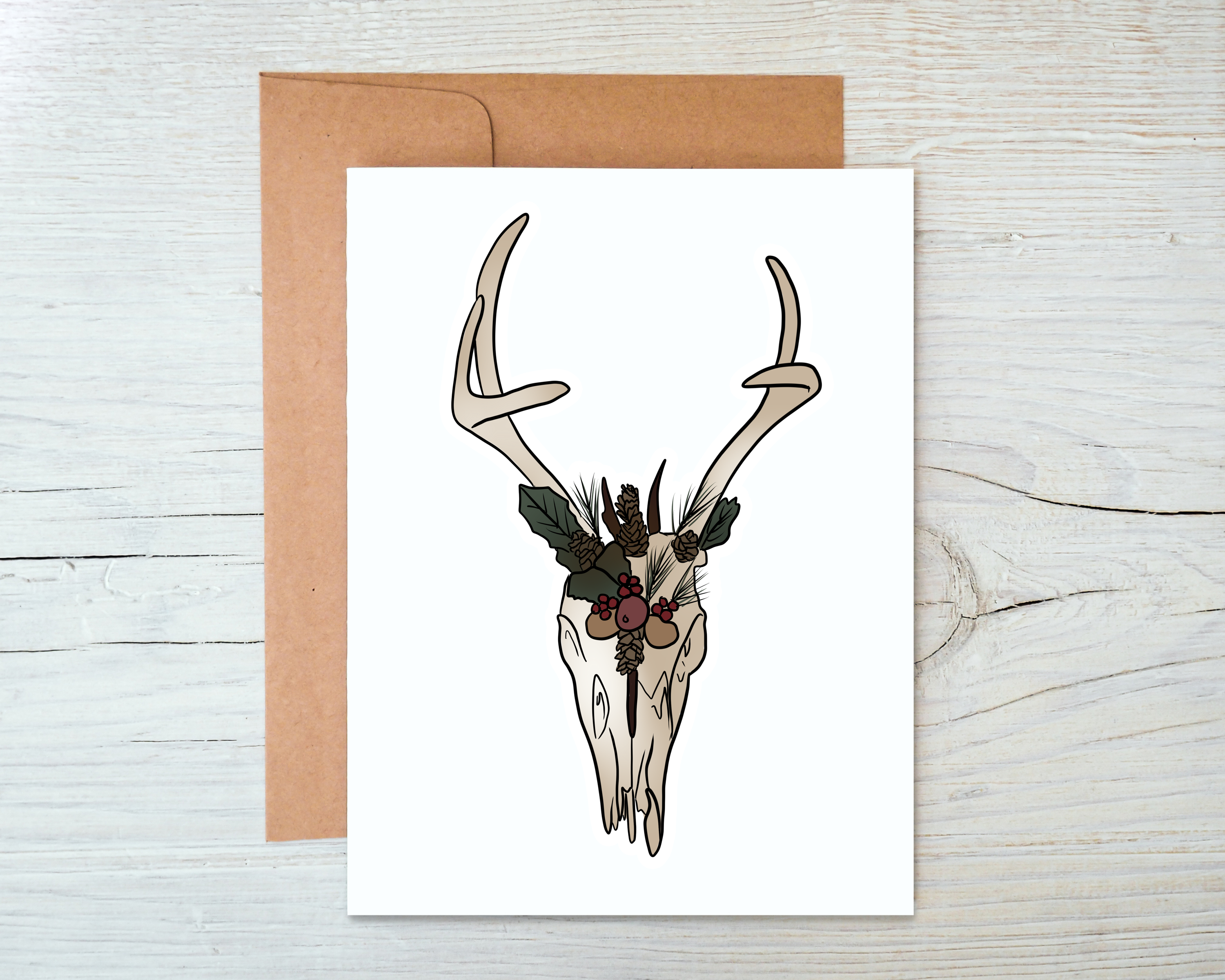 Yule Stag Card featuring a majestic stag design, blank inside, accompanied by a kraft envelope, perfect for holiday greetings.