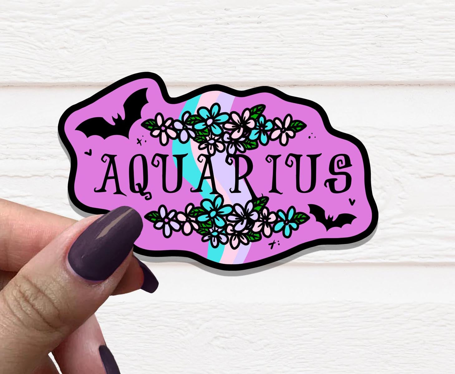 Zodiac Aquarius Vinyl Sticker featuring the Aquarius symbol on a matte finish, ideal for personalizing various items.