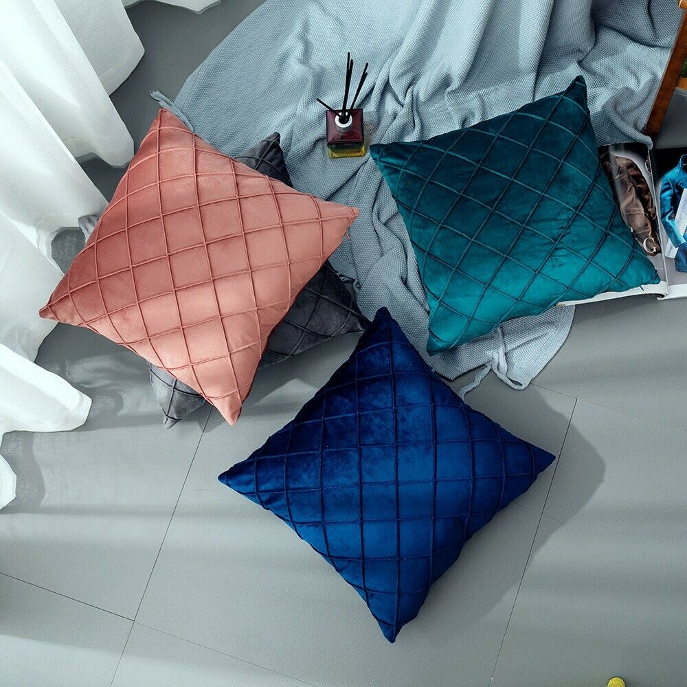 A set of 3D pattern velvet cushion covers in geometric design, measuring 43x43cm, showcasing a luxurious texture and vibrant colors.