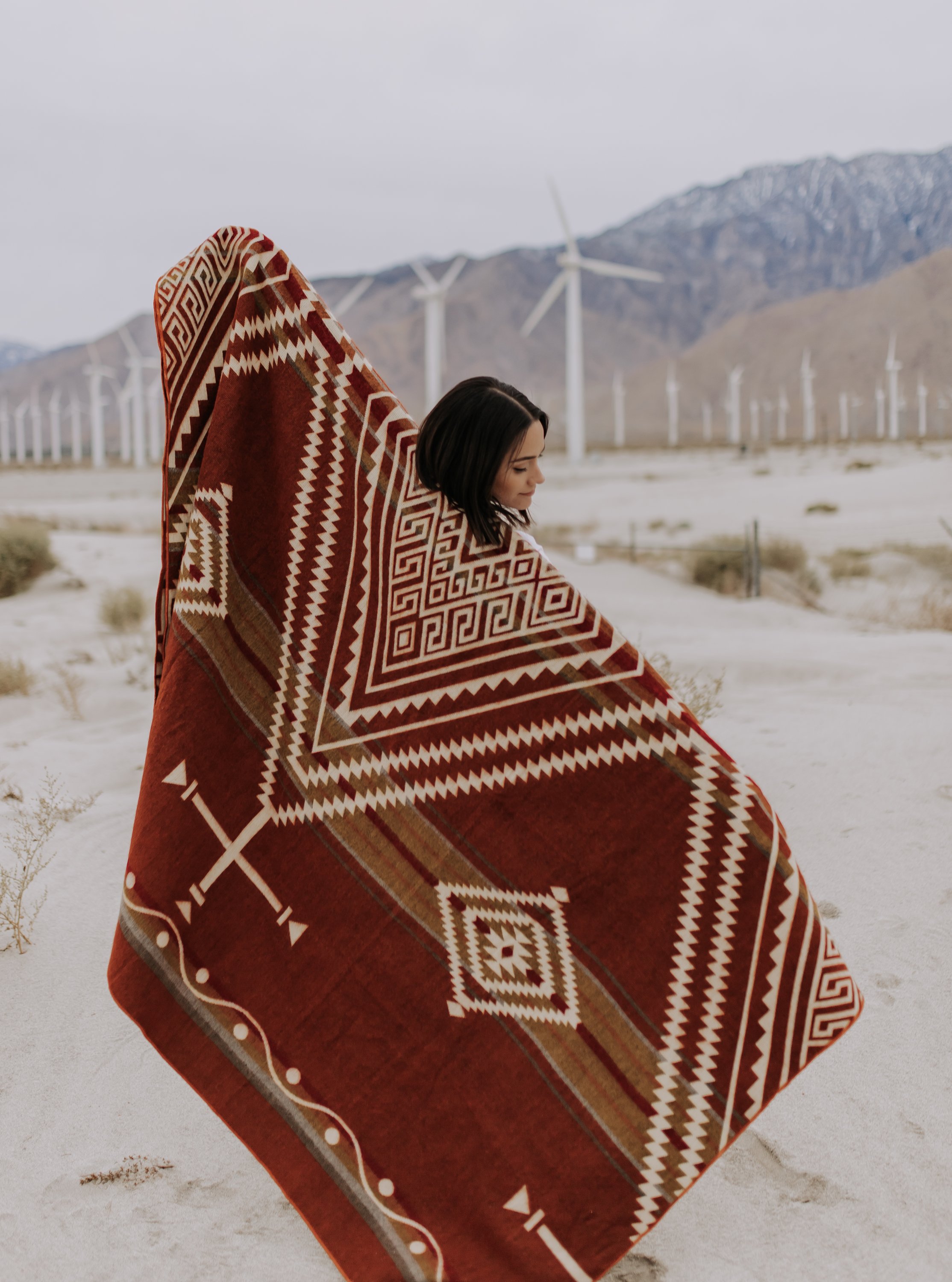 Achuar Blanket - Autumn, a vibrant and cozy blanket handcrafted by indigenous artisans from Ecuador, featuring reversible colors and soft texture.