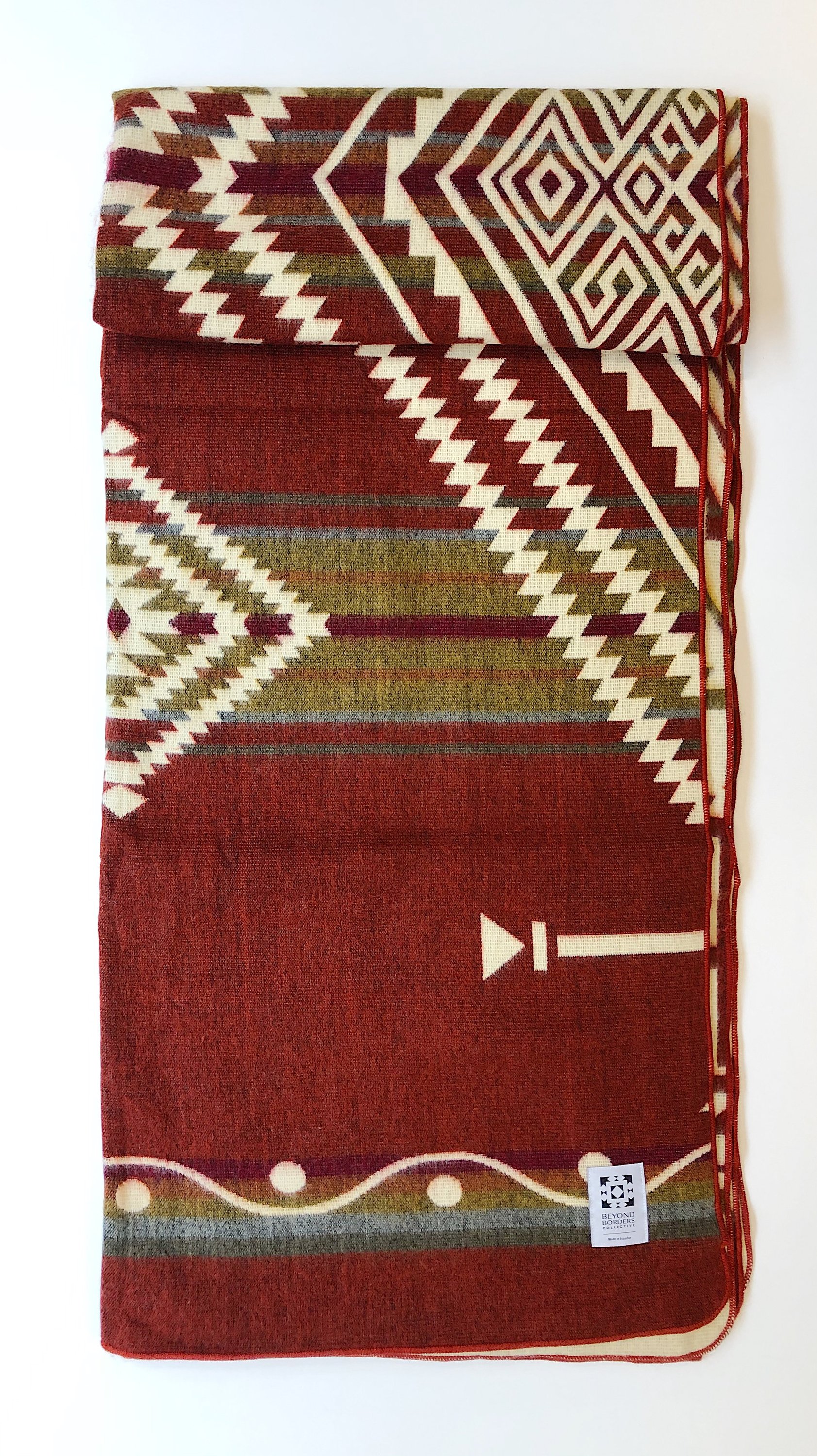 Achuar Blanket - Autumn, a vibrant and cozy blanket handcrafted by indigenous artisans from Ecuador, featuring reversible colors and soft texture.