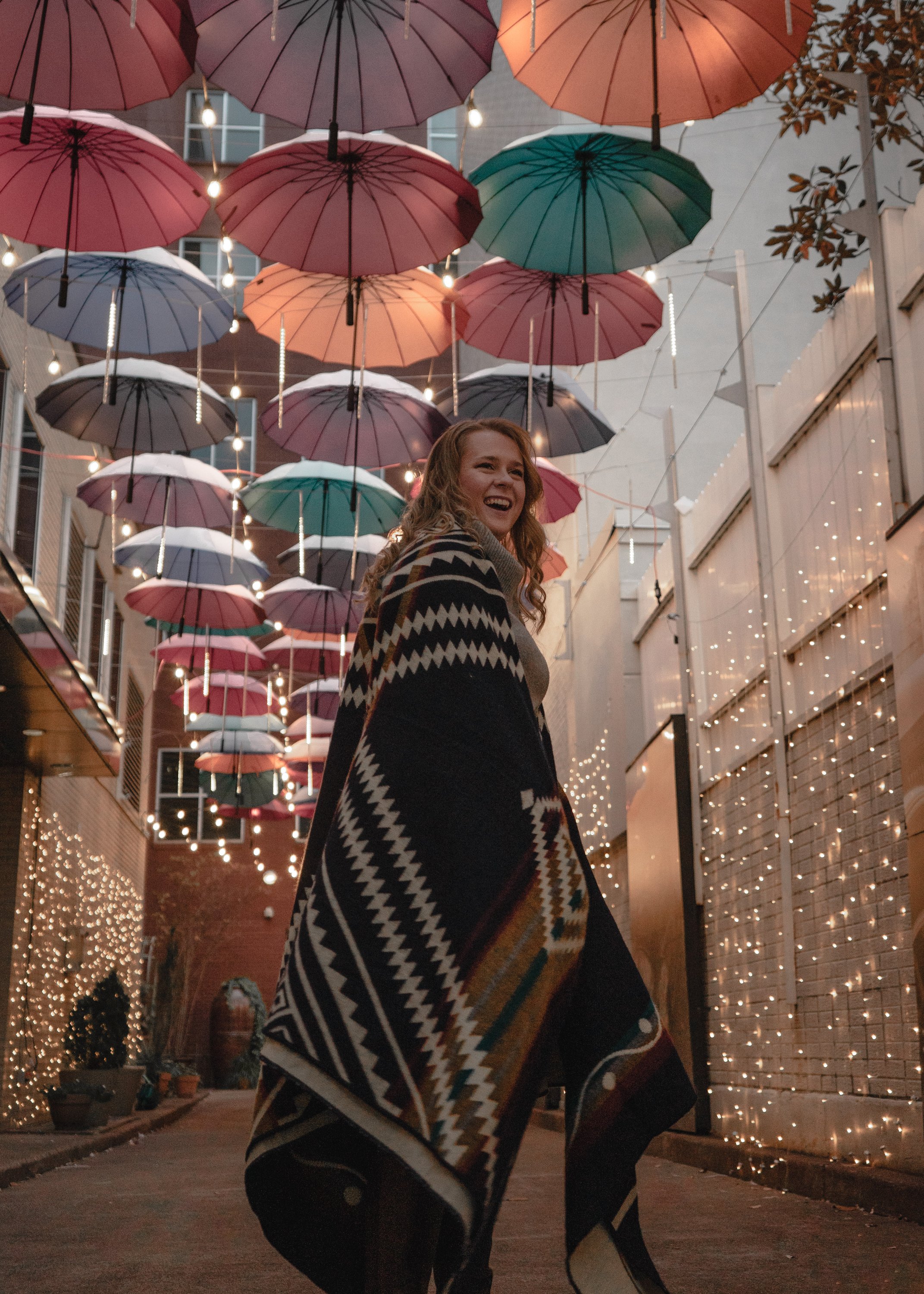 Achuar Blanket in Dark Navy, handcrafted from recycled acrylic, showcasing reversible colors and a cozy design, perfect for indoor and outdoor use.