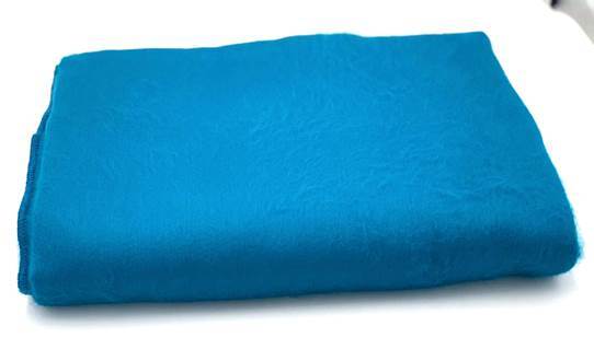 Cozy alpaca bed blanket in various colors, showcasing its soft texture and luxurious feel.