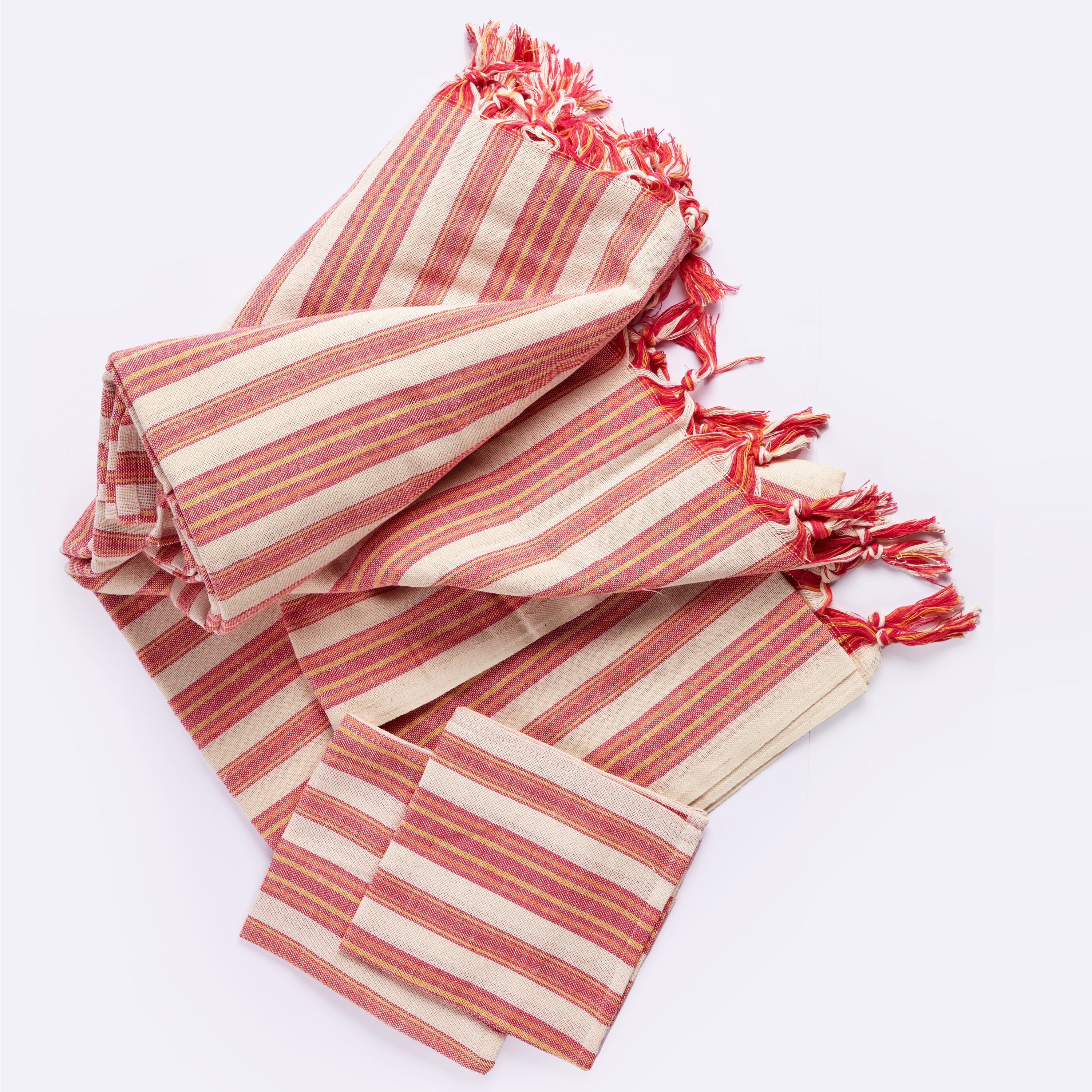 Andana Striped Tablecloth Set in Magenta with matching napkins, showcasing eco-friendly design and stylish stripes.