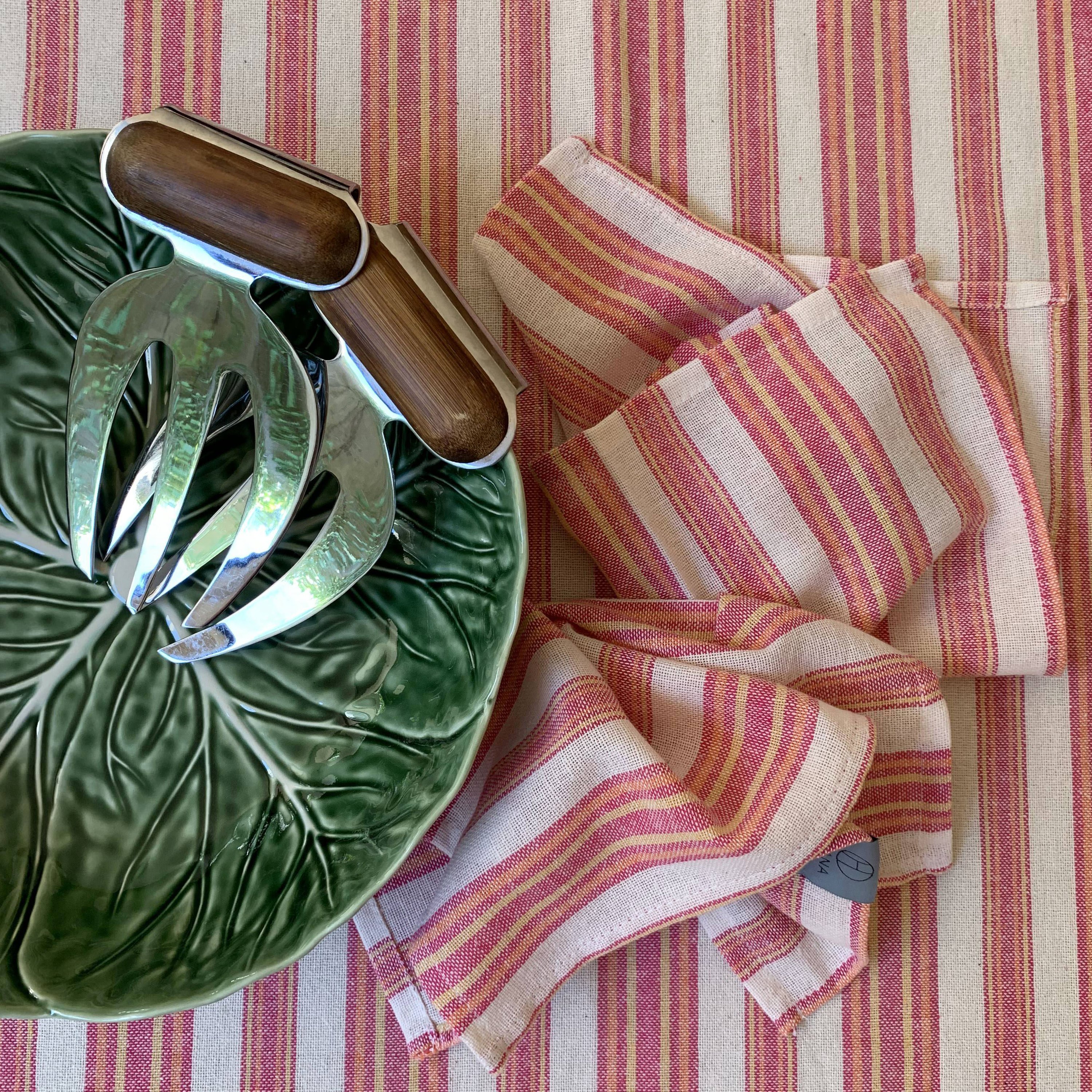 Andana Striped Tablecloth Set in Magenta with matching napkins, showcasing eco-friendly design and stylish stripes.