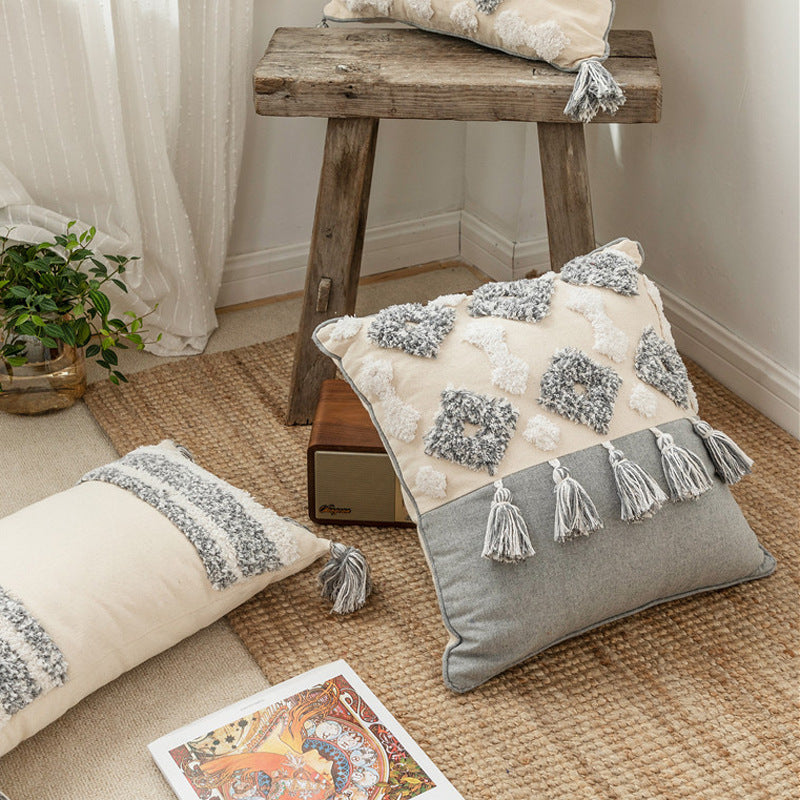 A stylish Canvas Tassel Square Pillow Case made from premium cotton, featuring elegant tassels and a zipper closure, perfect for home decor.