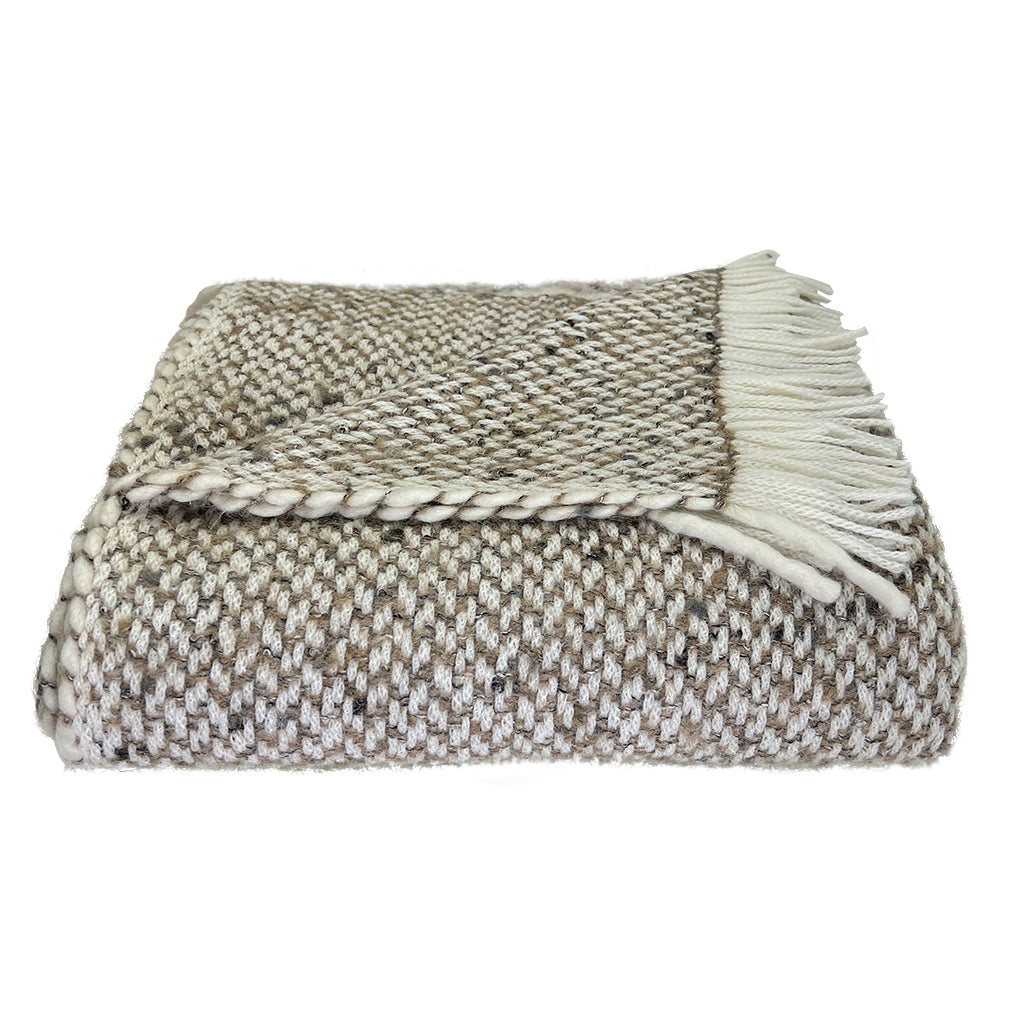 Chunky Camel Weave Alpaca Throw showcasing soft texture and neutral colors, perfect for home decor.