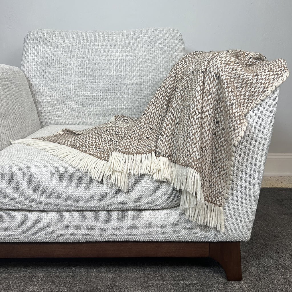 Chunky Camel Weave Alpaca Throw showcasing soft texture and neutral colors, perfect for home decor.