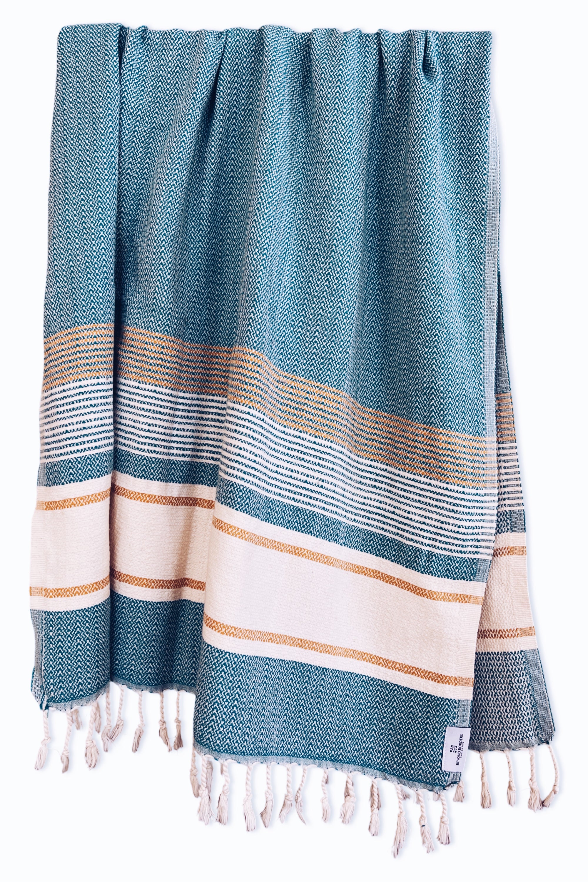 Cicek Turkish Cotton Towel in teal, showcasing its soft texture and vibrant color, perfect for beach or home use.