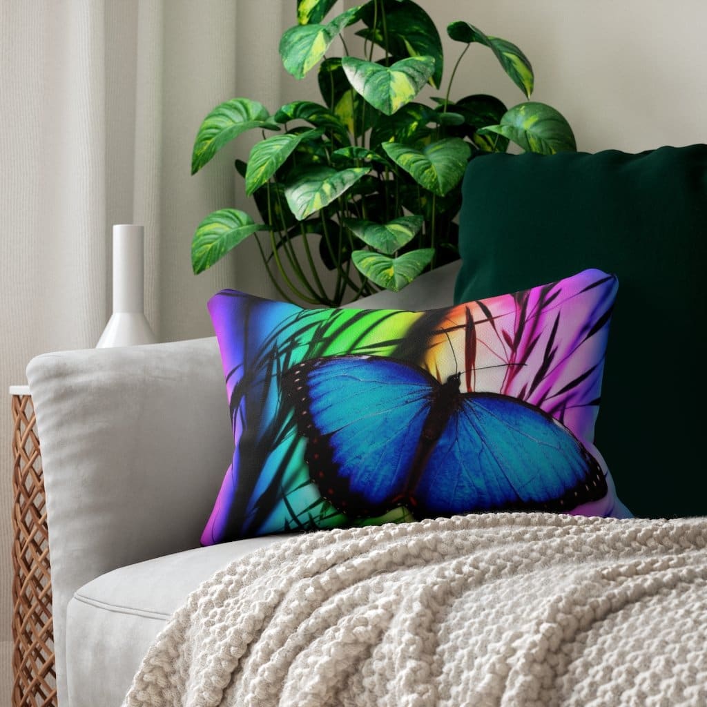 Decorative lumbar throw pillow featuring a blue butterfly design on a spun-polyester fabric, with a concealed zipper and removable insert.