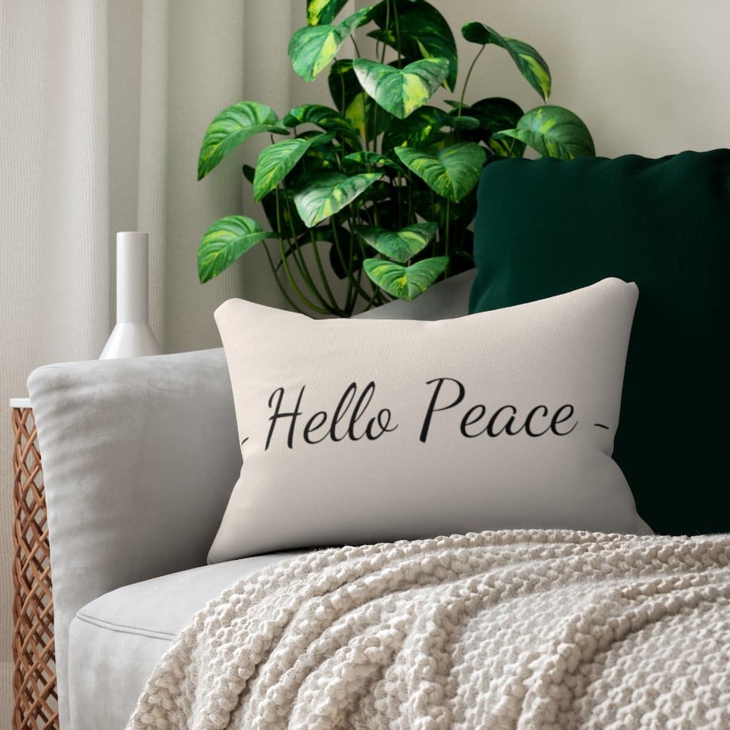 Decorative lumbar throw pillow in beige and black with 'Hello Peace' design, featuring a concealed zipper and double-sided print.