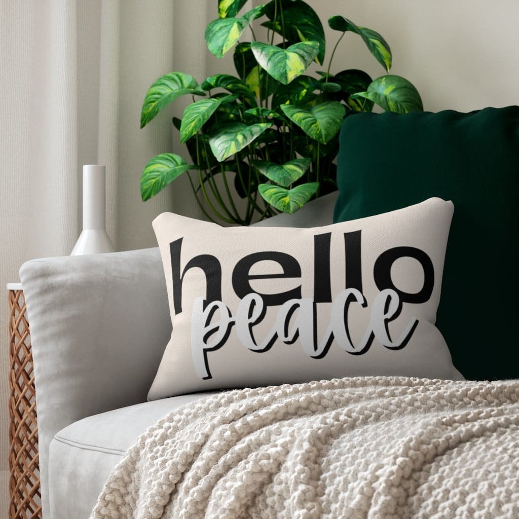 Decorative lumbar throw pillow in beige and black with 'Hello Peace' design, featuring a concealed zipper and plush stuffing.