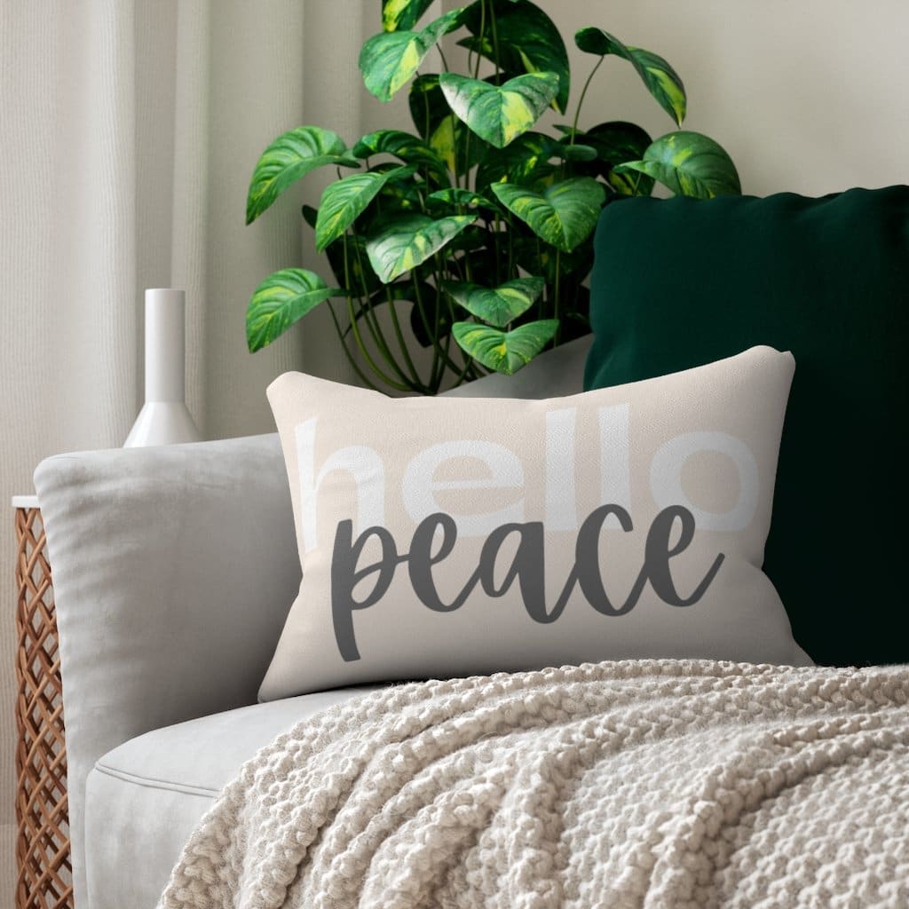 Decorative lumbar throw pillow in black and beige with 'Hello Peace' design, featuring a concealed zipper and double-sided print.