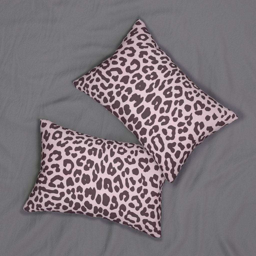 Decorative lumbar throw pillow featuring a stylish leopard print in pink and black, with a concealed zipper and removable insert.