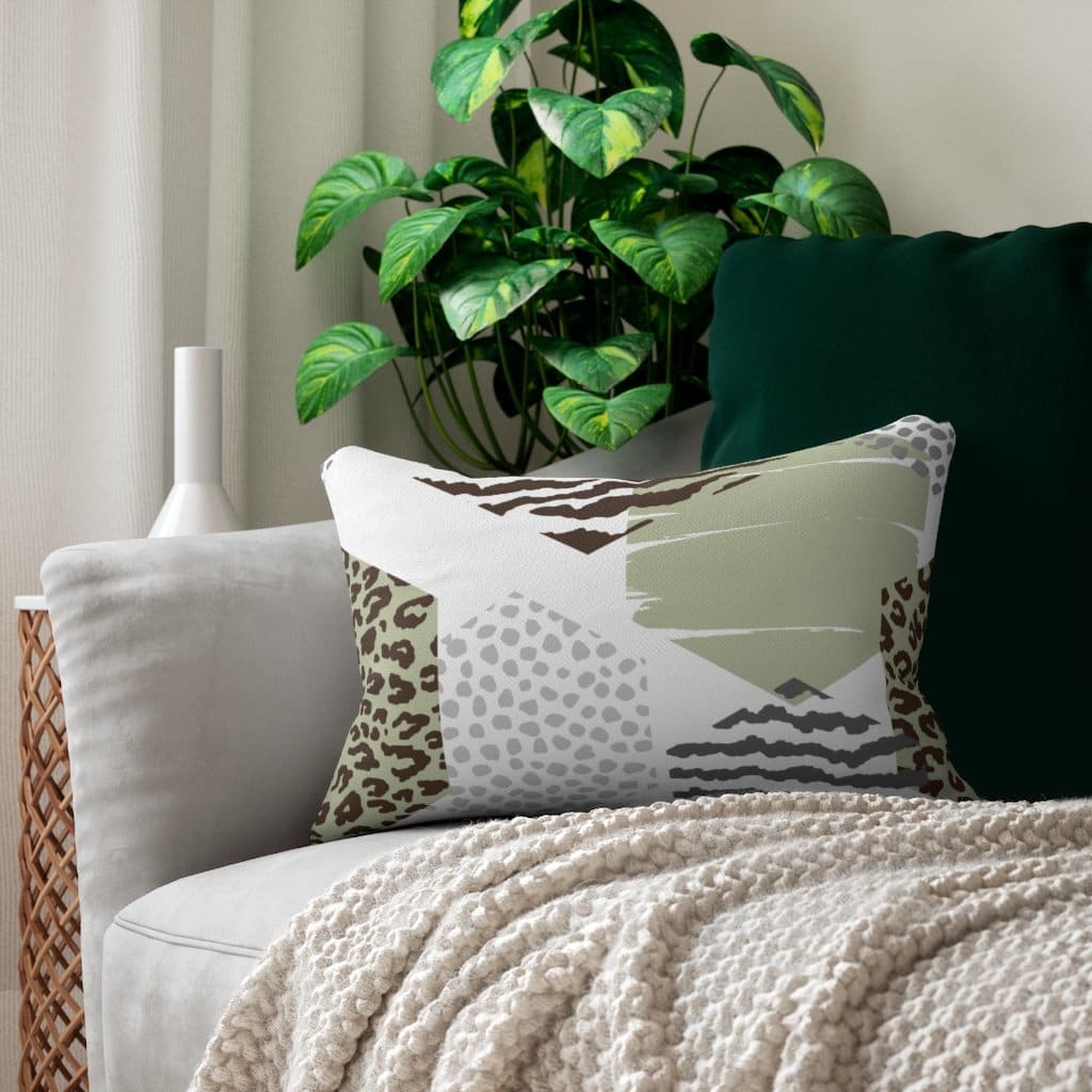 Decorative lumbar throw pillow featuring a pastel brown and green geometric design, showcasing its stylish and modern look.