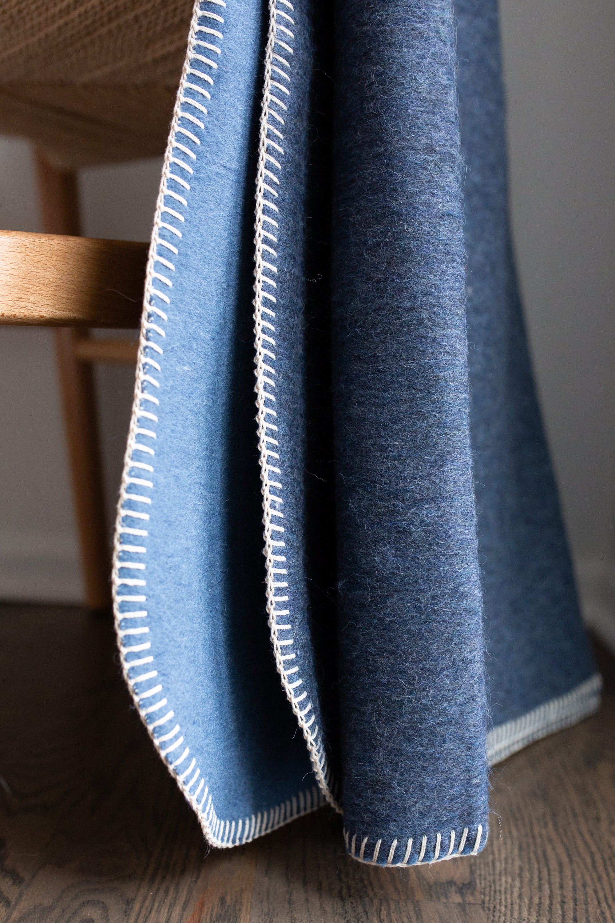 Descanso Alpaca Blend Throw in Navy Heather, showcasing its soft texture and elegant design, perfect for home decor.