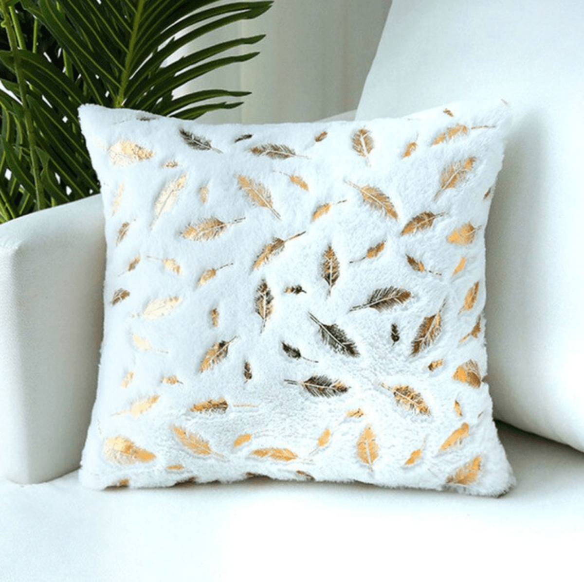 Dixie Plush pillows featuring soft velvet fabric and hand-painted gold decals, perfect for home decor.