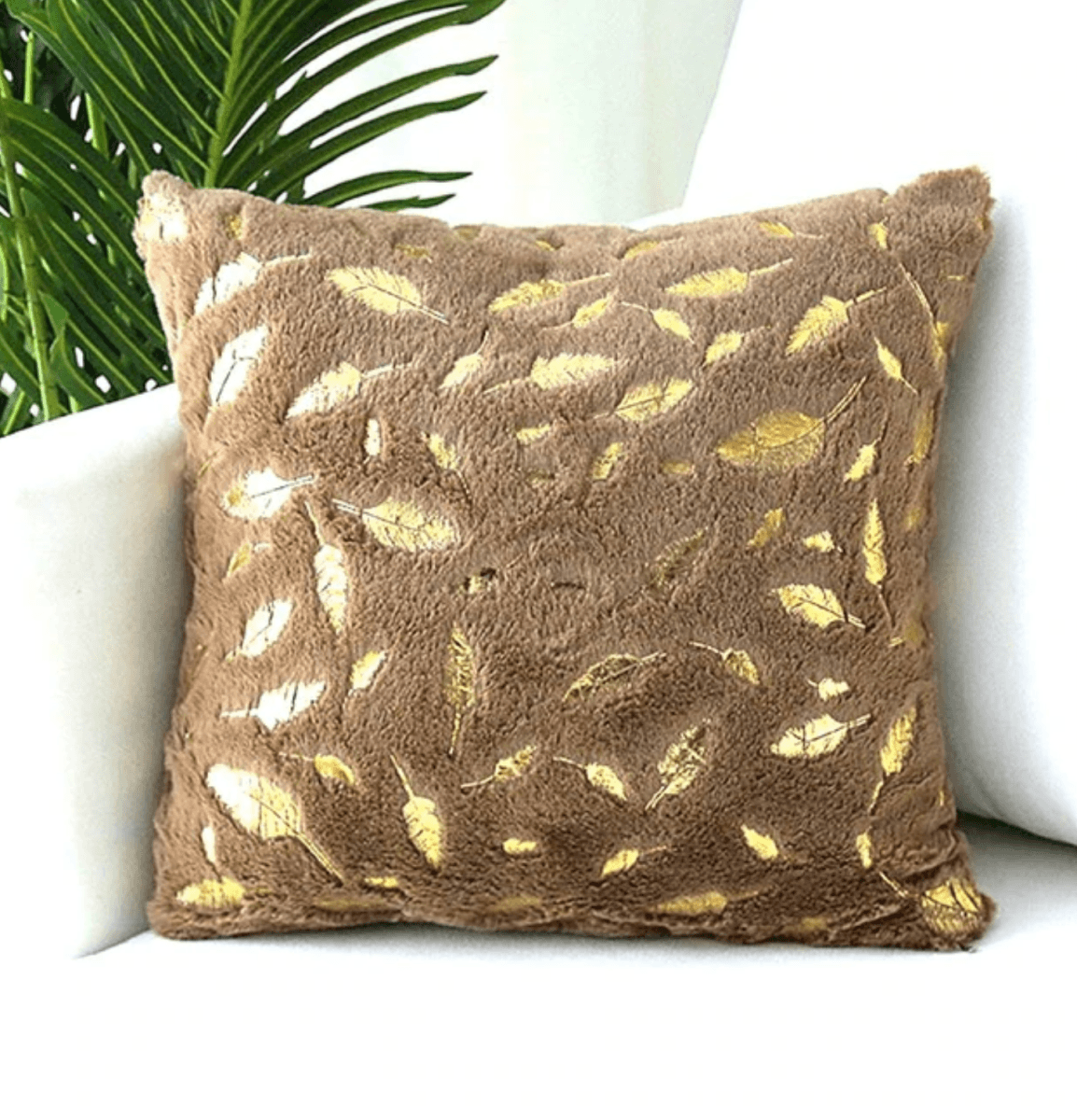 Dixie Plush pillows featuring soft velvet fabric and hand-painted gold decals, perfect for home decor.